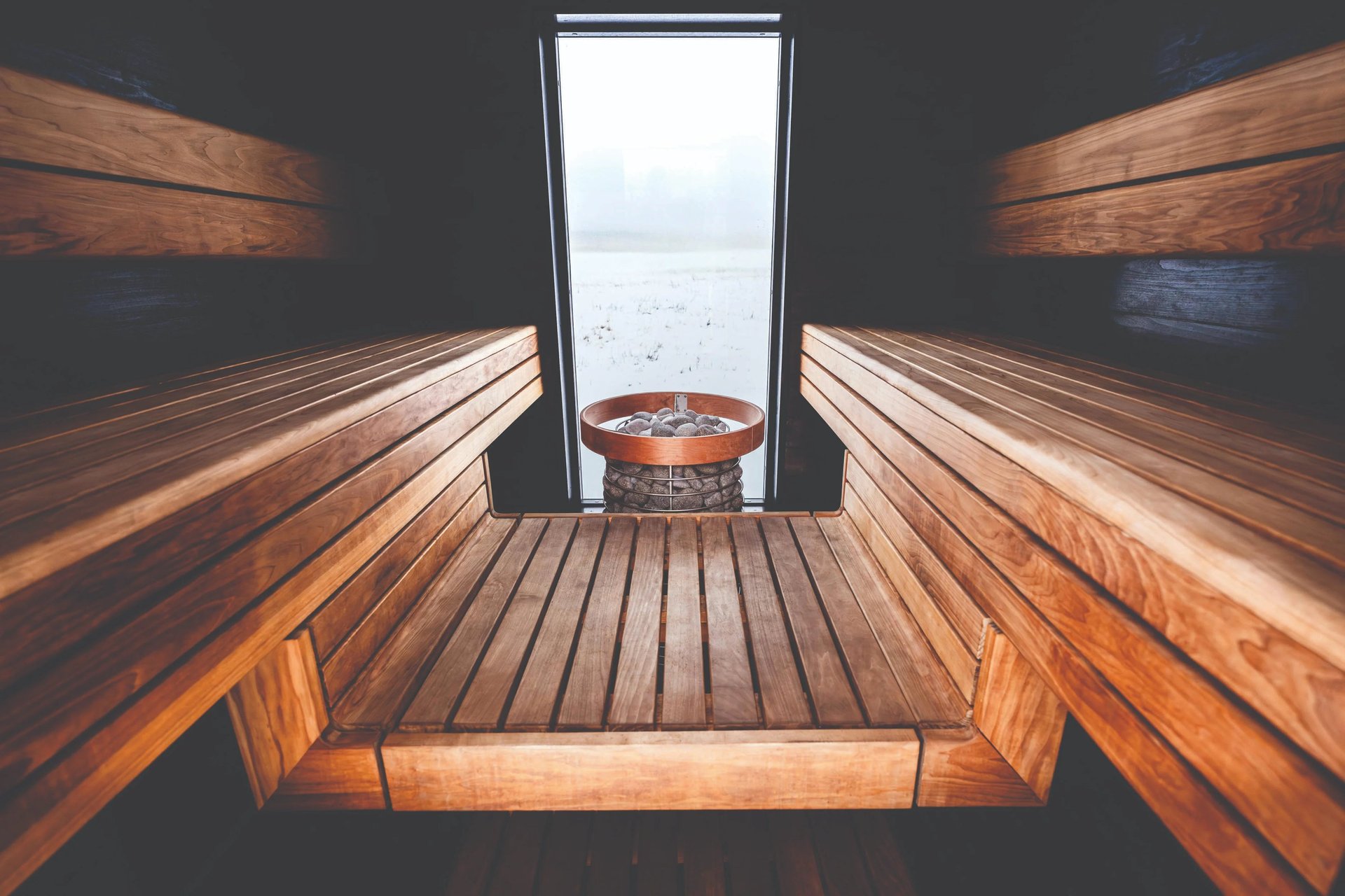 Scandinavian cedar sauna interior with warm lighting in an Outdoor sauna Ontario