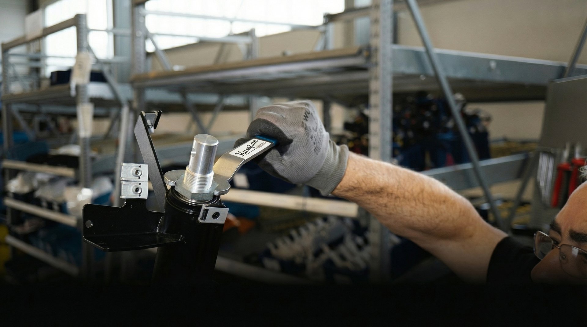 person holding black and silver steel tool