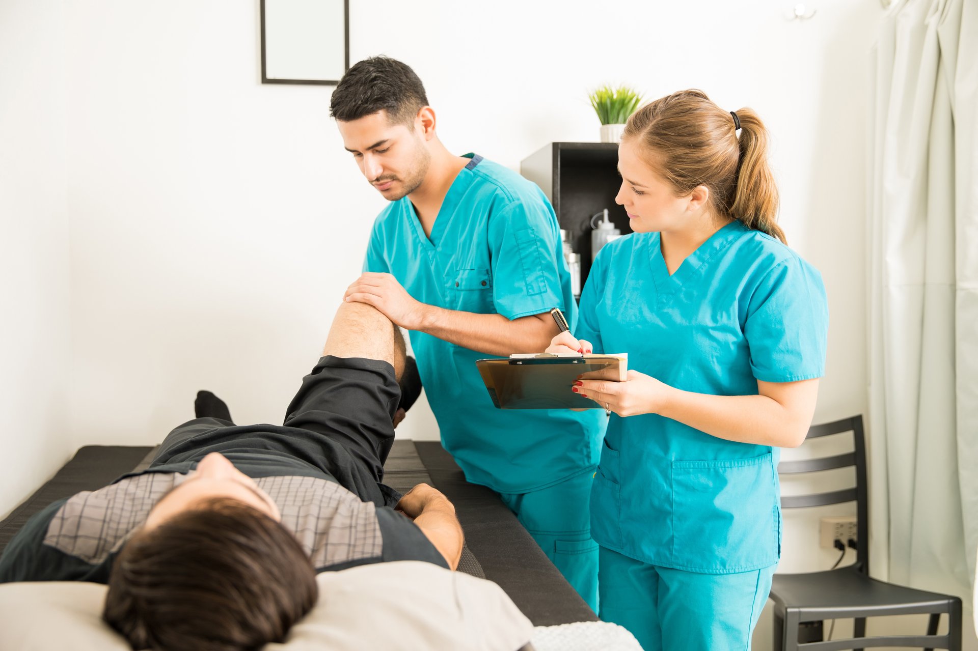 a woman getting a back massage from a massager