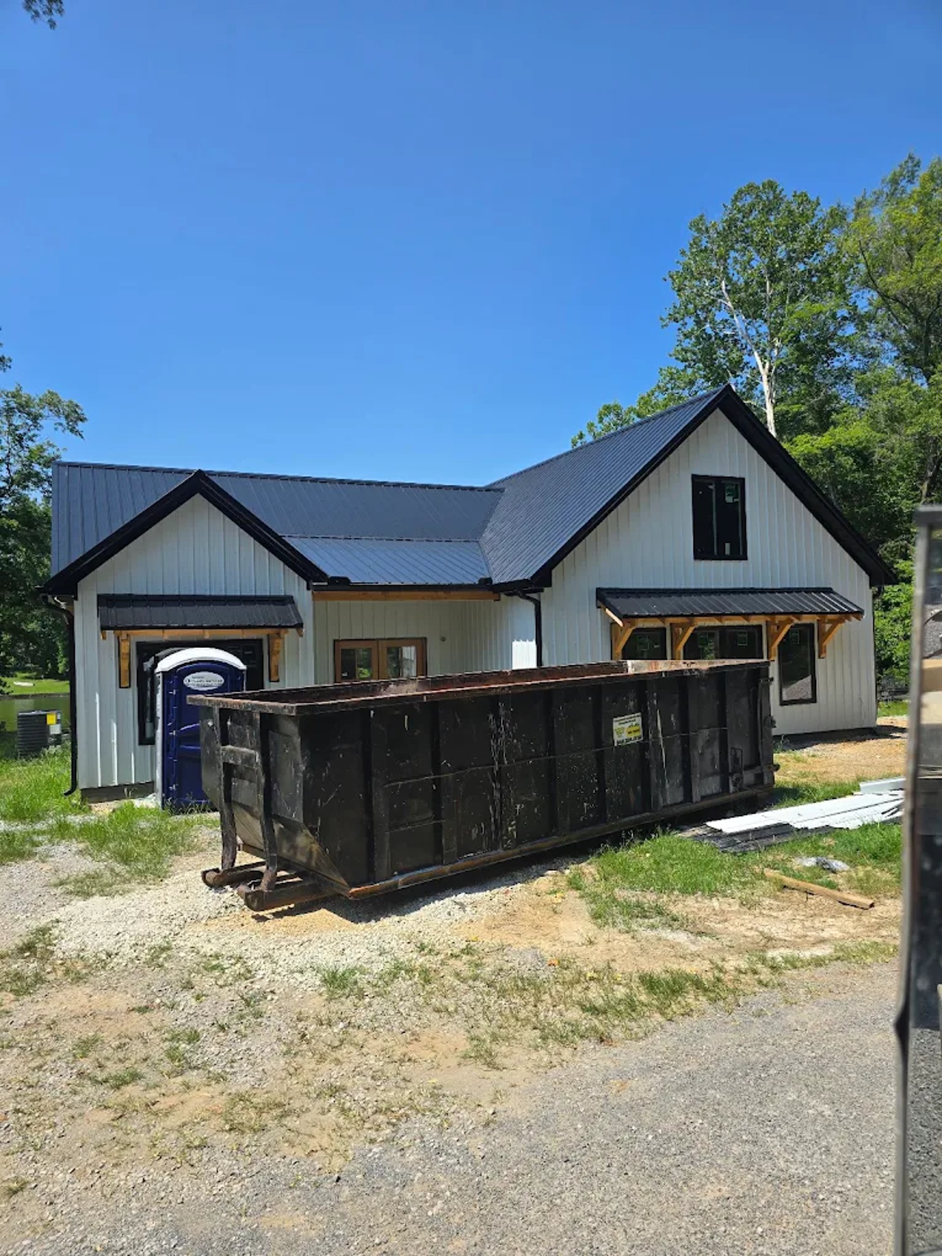white and brown utility trailer on green grass field