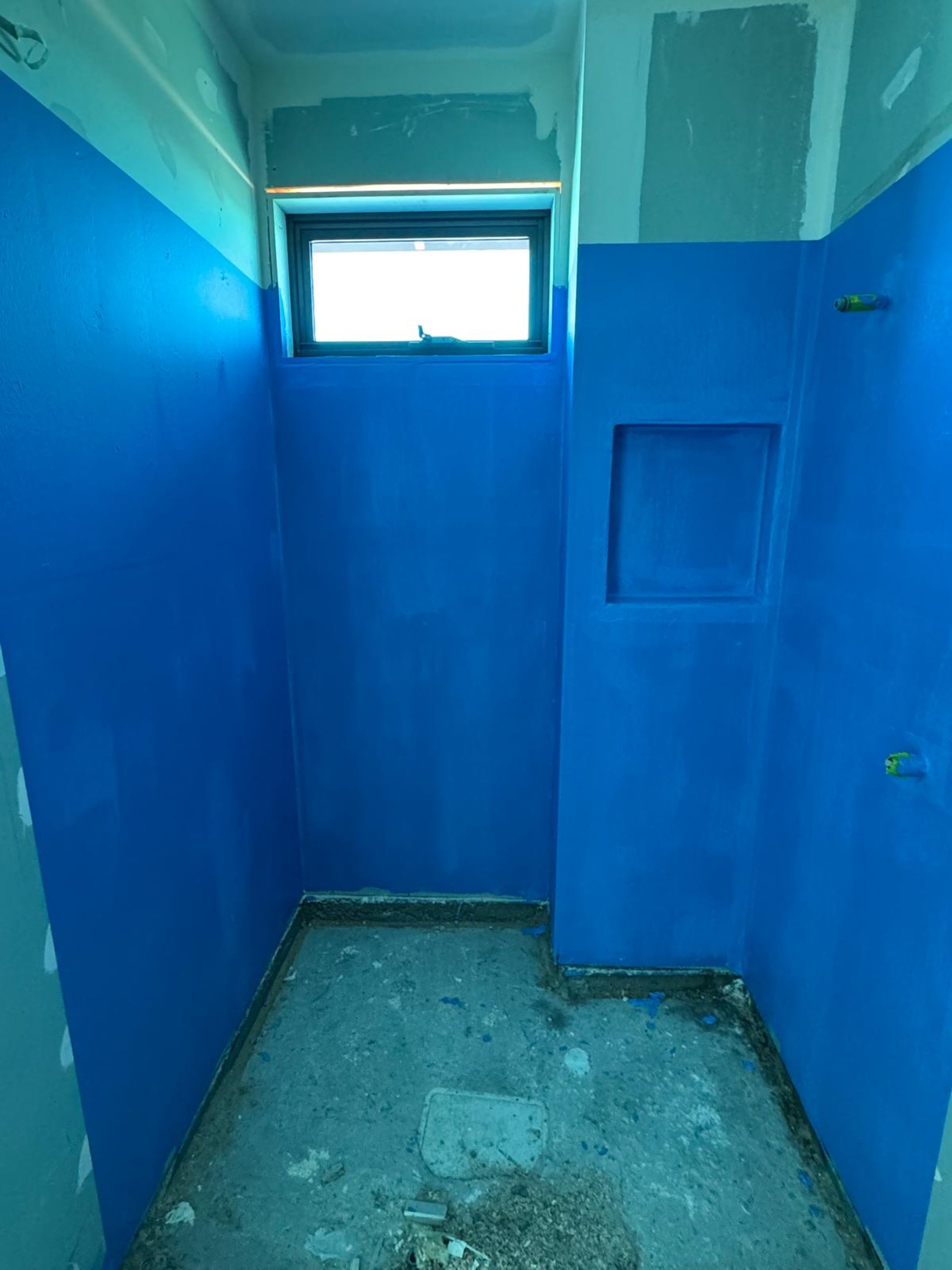 an abstract photo of a curved building with a blue sky in the background