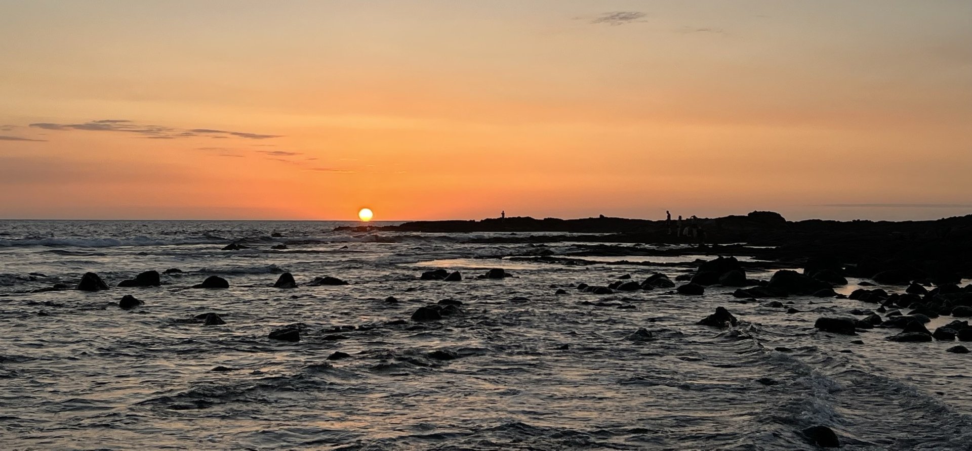 man taking photo of hot air balloons