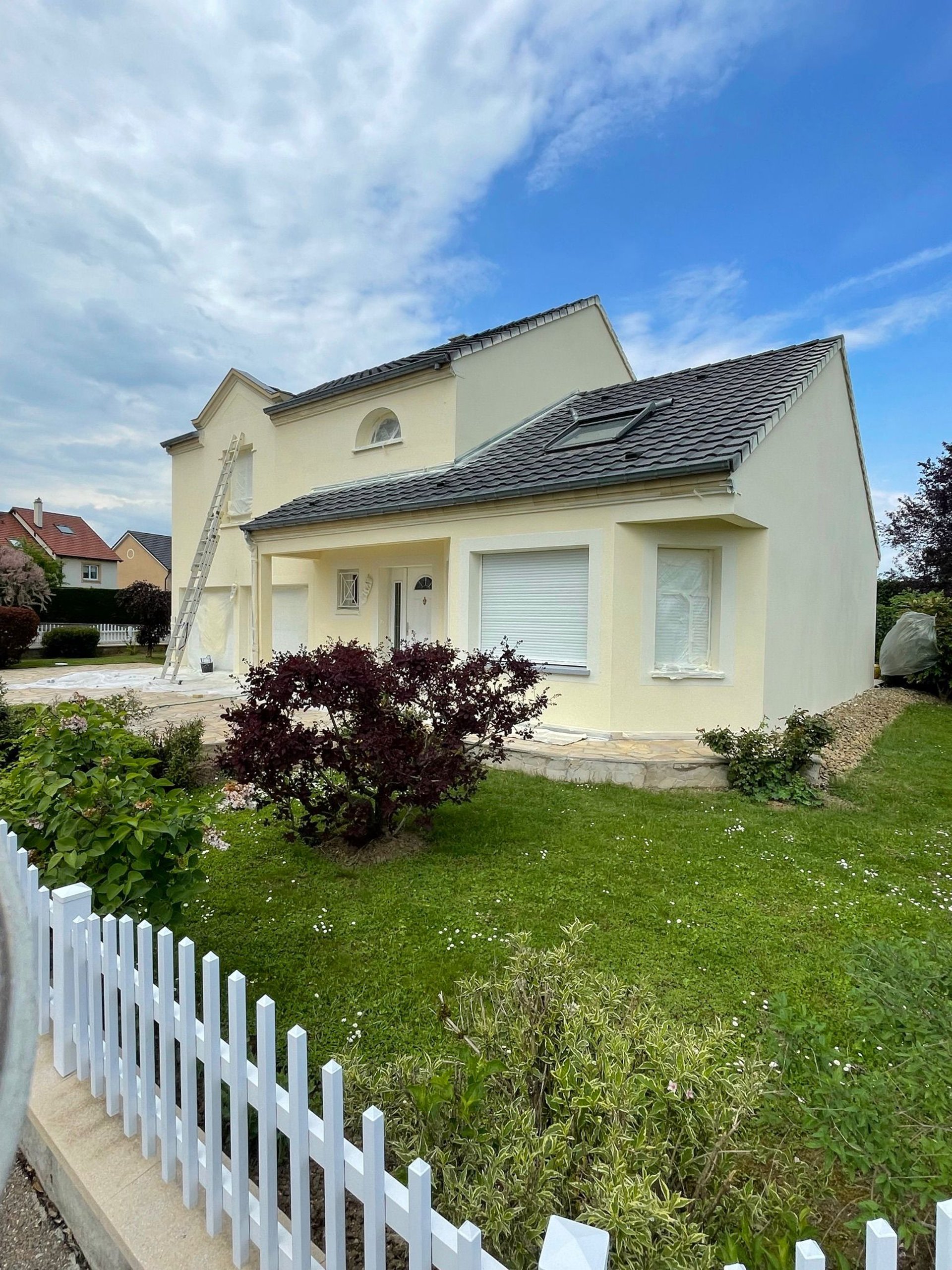 an abstract photo of a curved building with a blue sky in the background