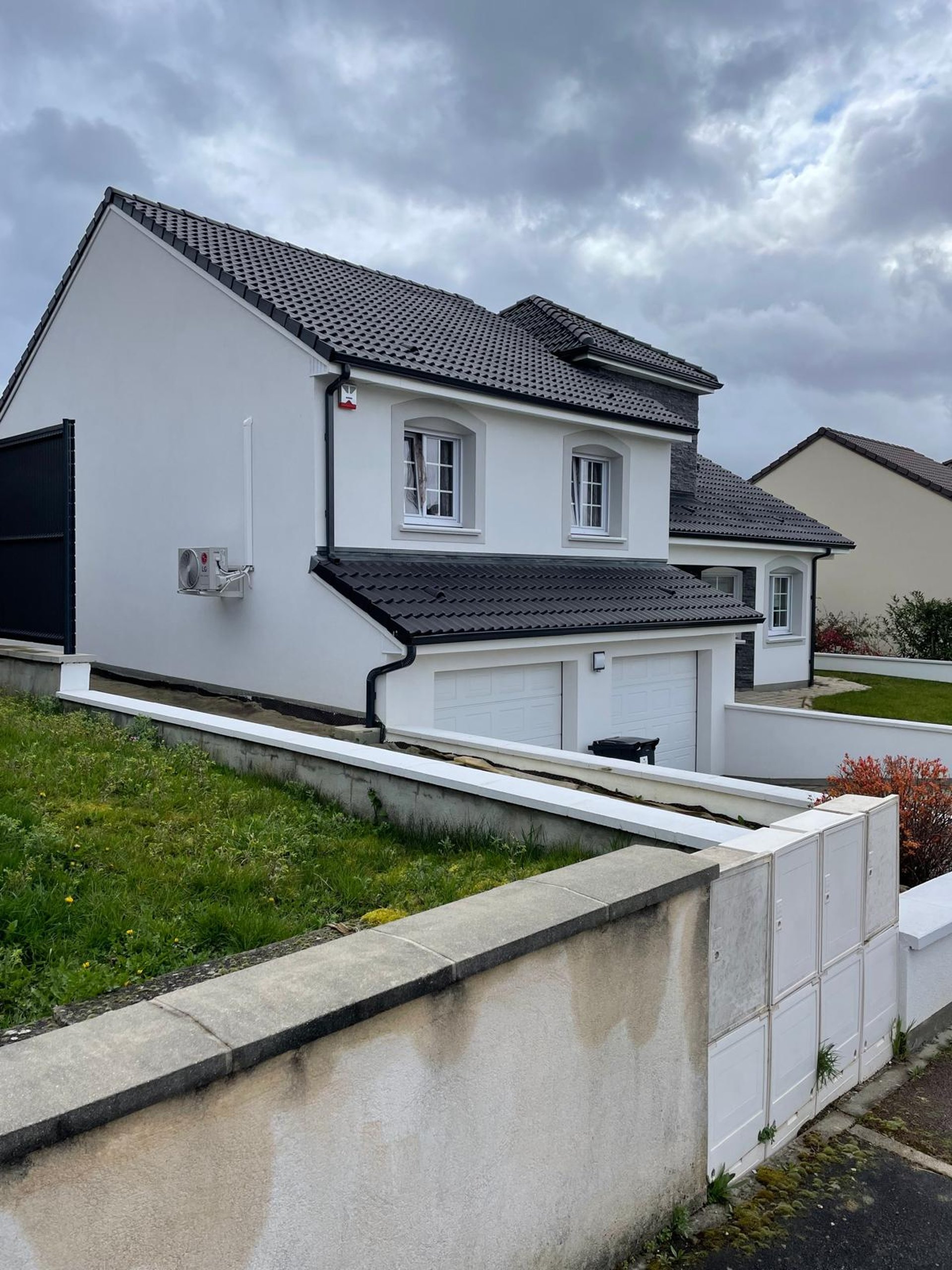 an abstract photo of a curved building with a blue sky in the background