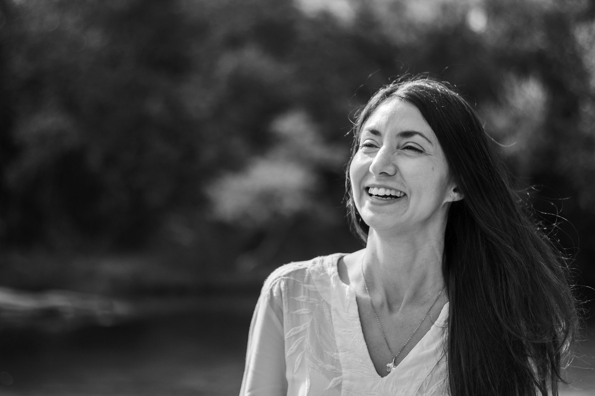 woman in white and brown dress standing on green grass during night time