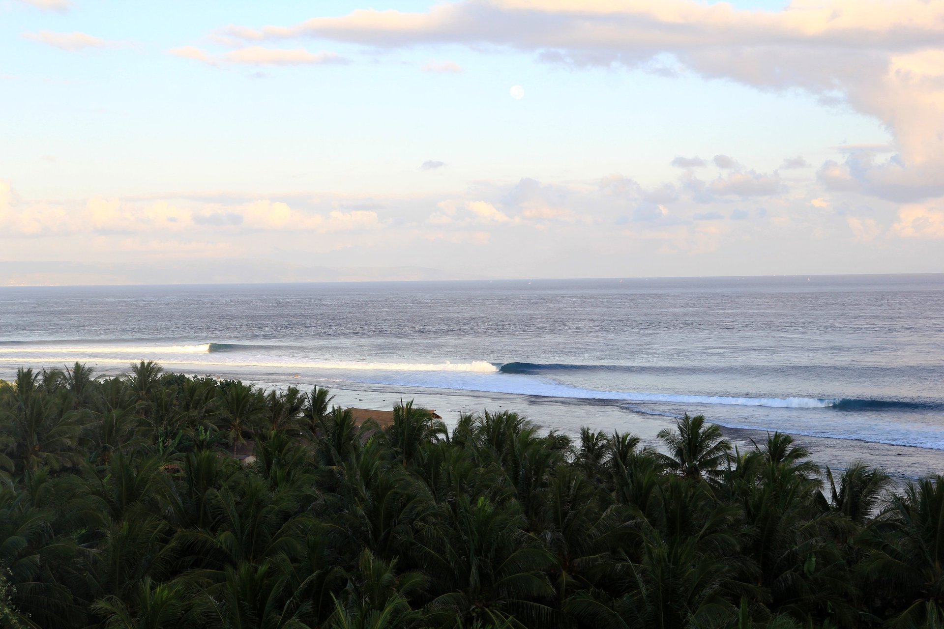 an abstract photo of a curved building with a blue sky in the background