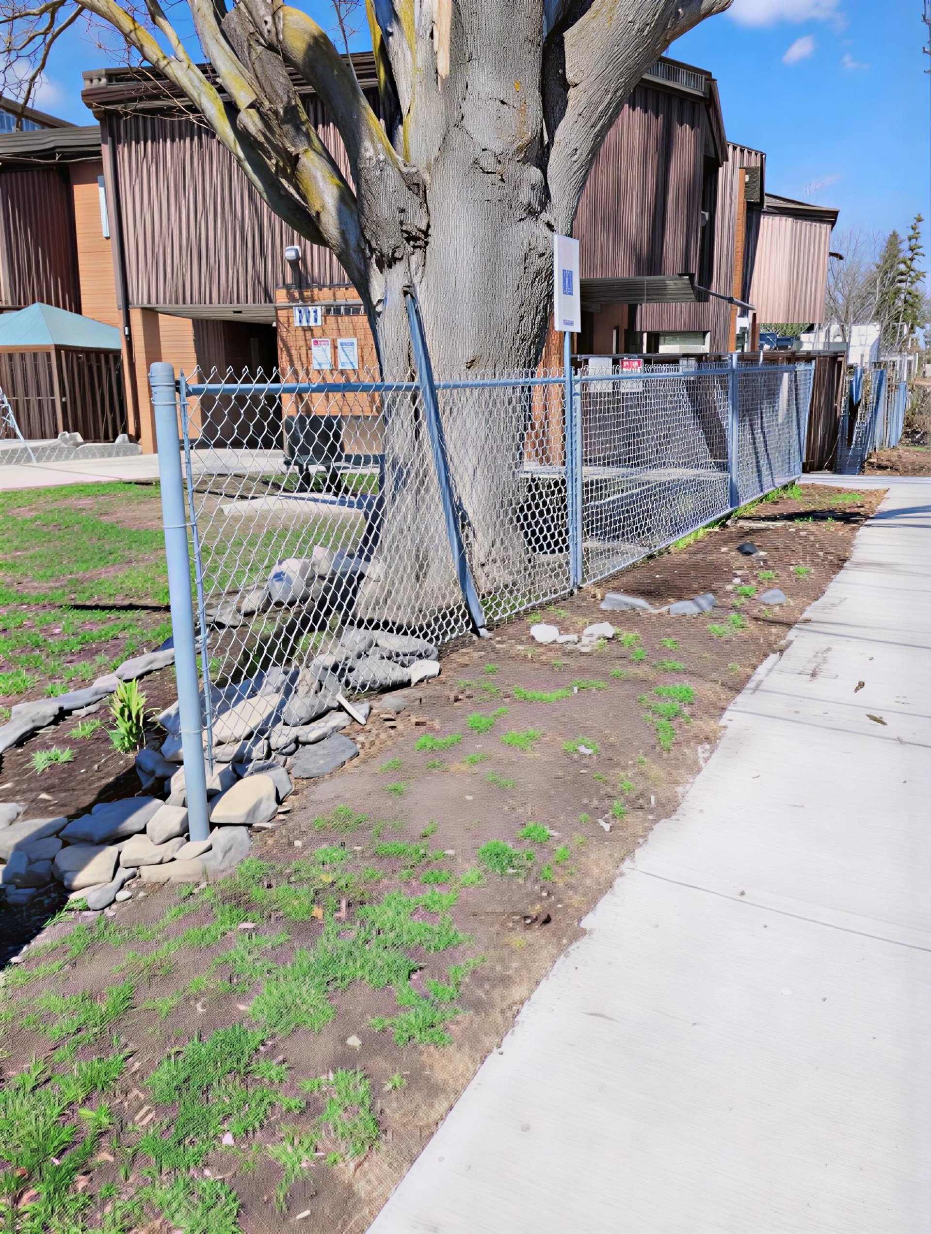 an abstract photo of a curved building with a blue sky in the background