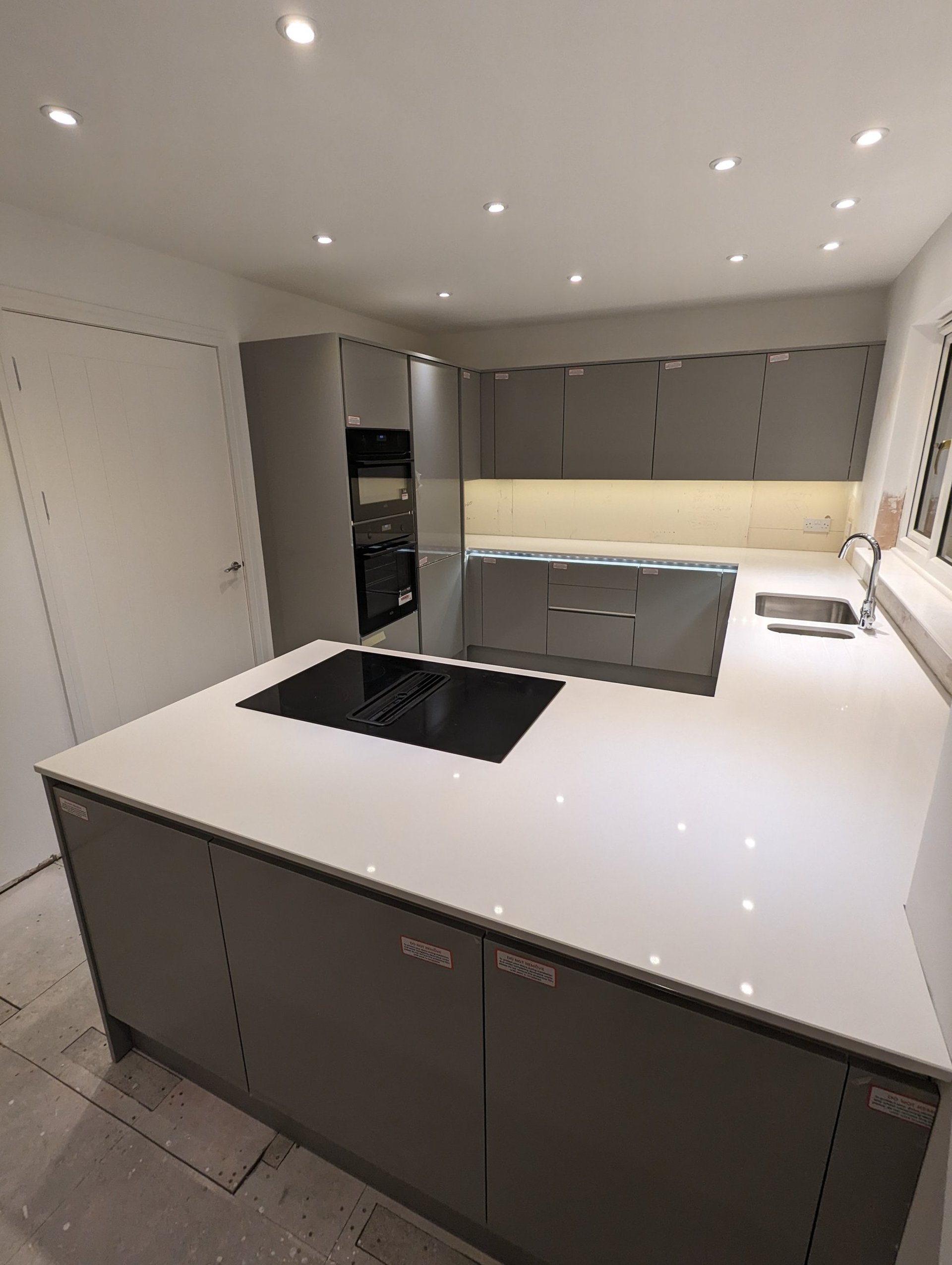 black and brown leather padded tub sofa