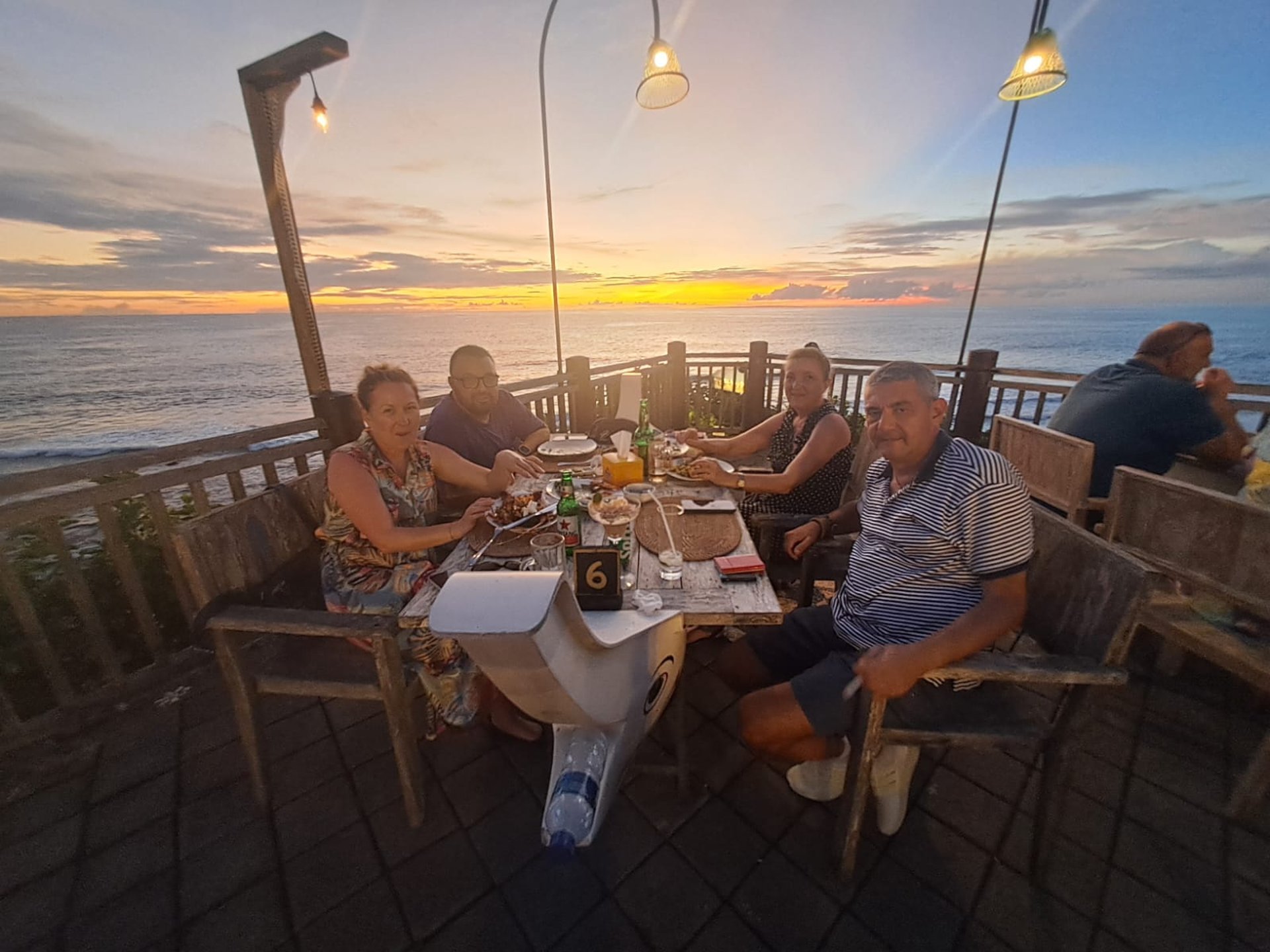woman wearing yellow long-sleeved dress under white clouds and blue sky during daytime