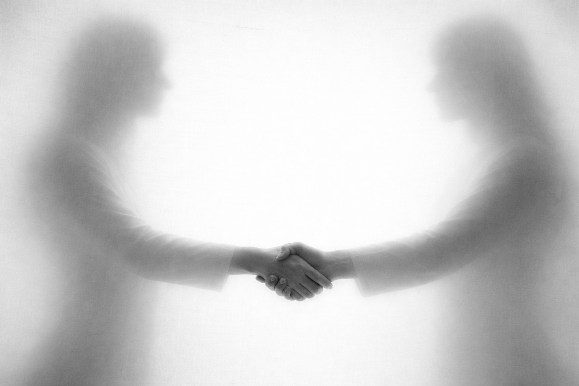 an abstract photo of a curved building with a blue sky in the background