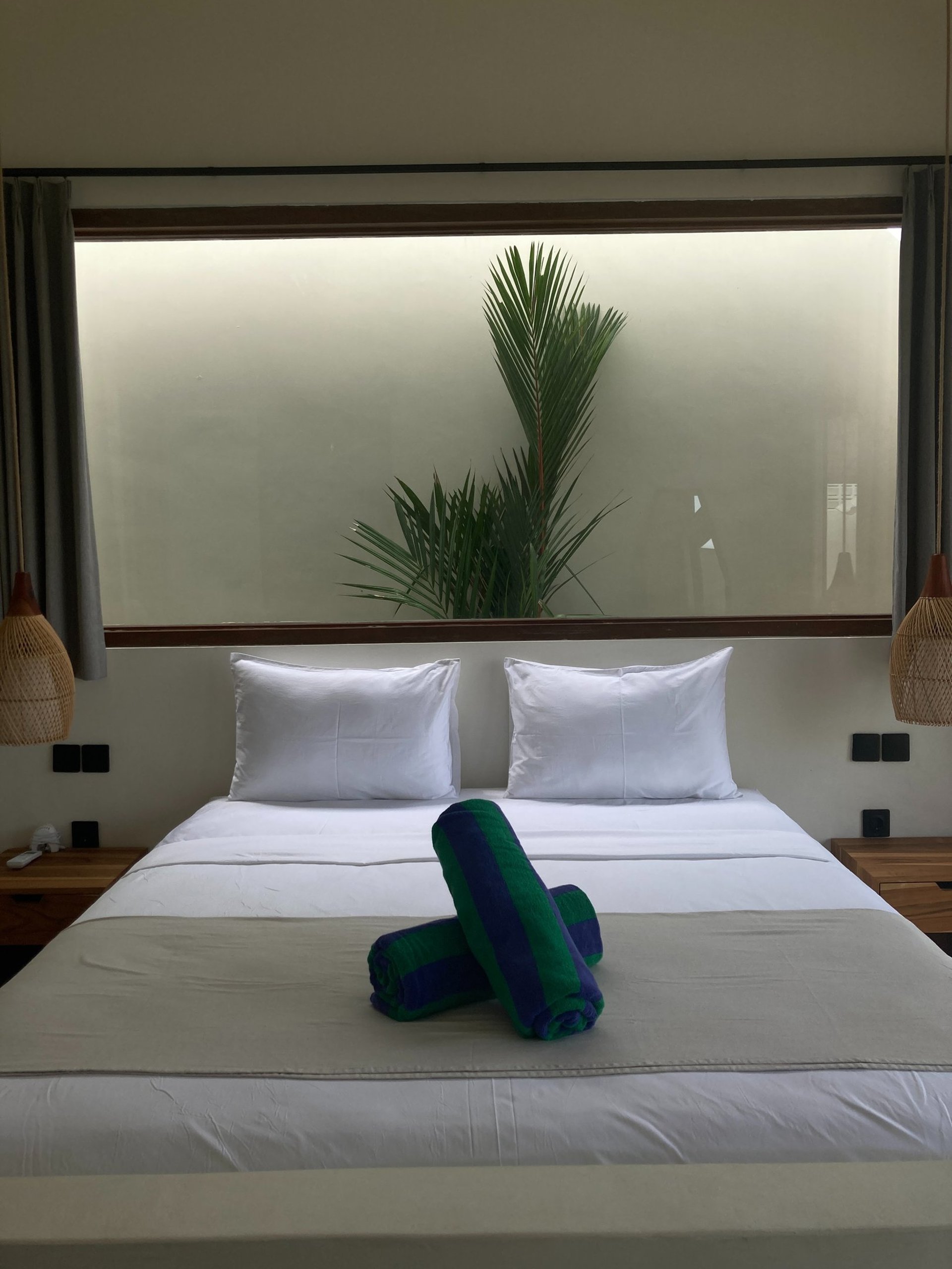 white and brown concrete building near green grass field during daytime