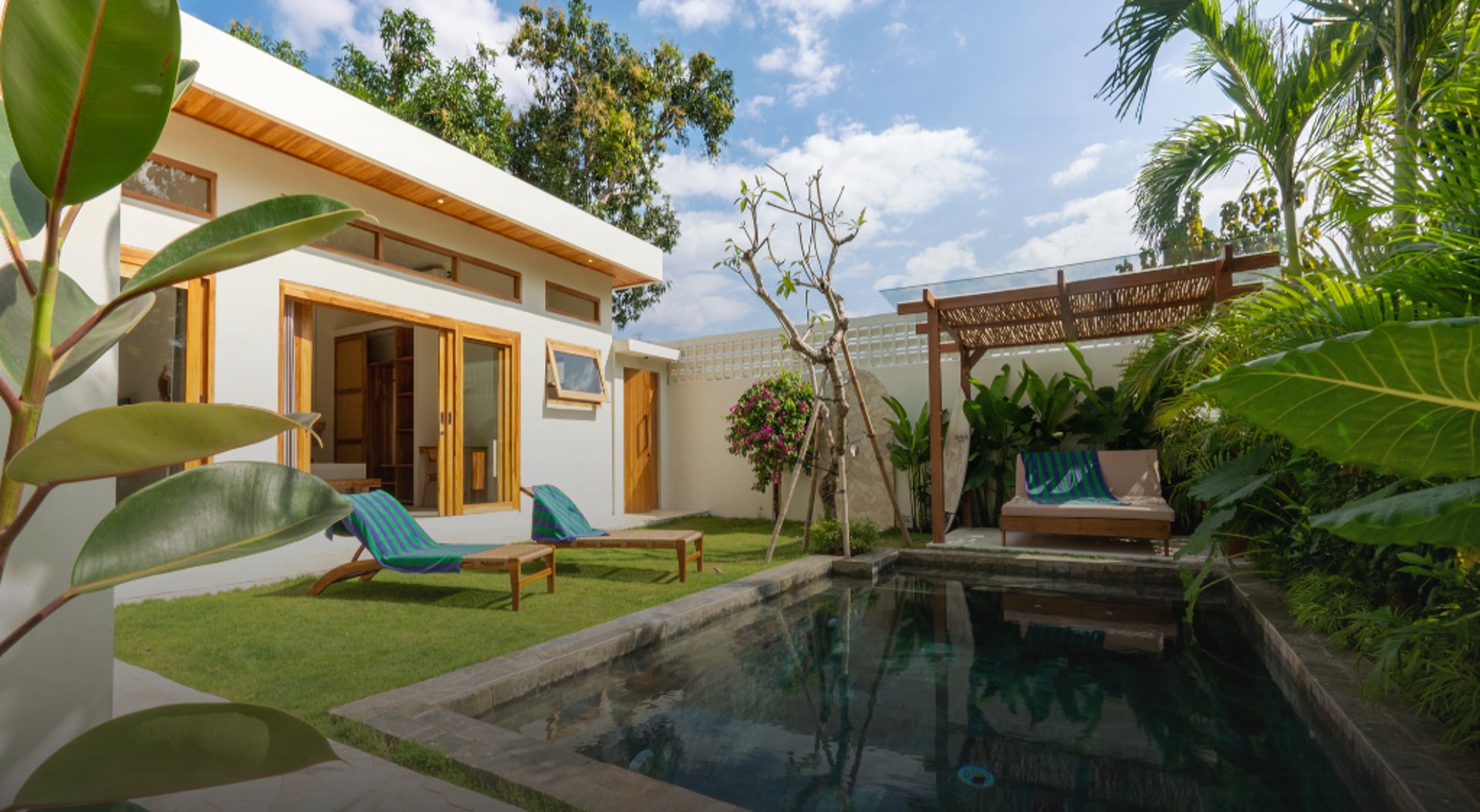 white and brown concrete building near green grass field during daytime