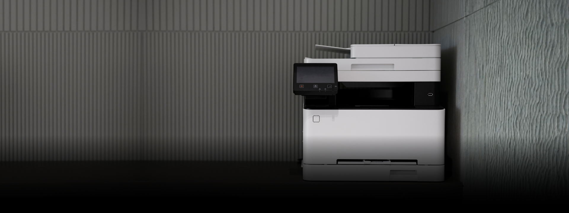 a white and black printer sitting on top of a counter