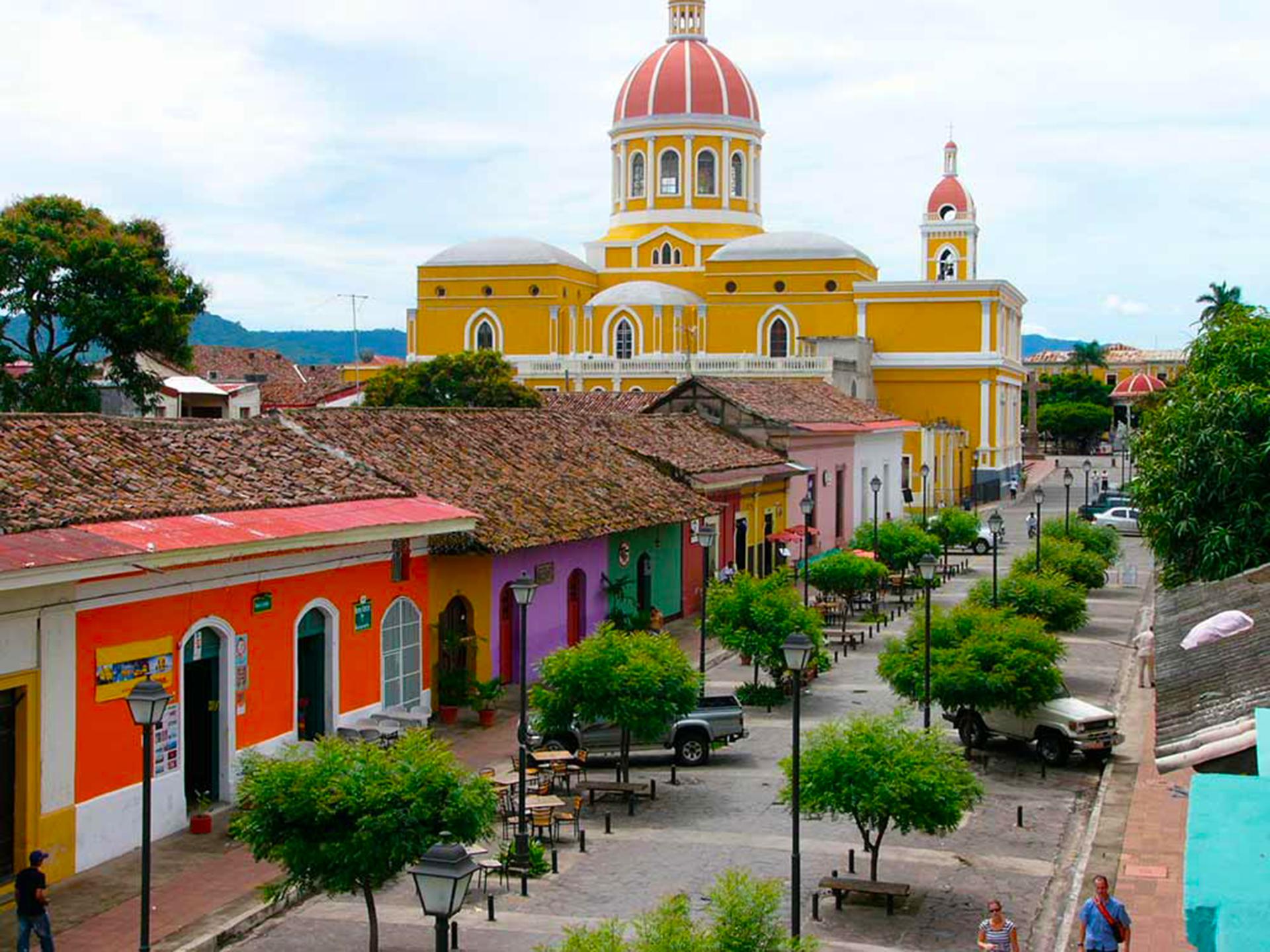 an abstract photo of a curved building with a blue sky in the background