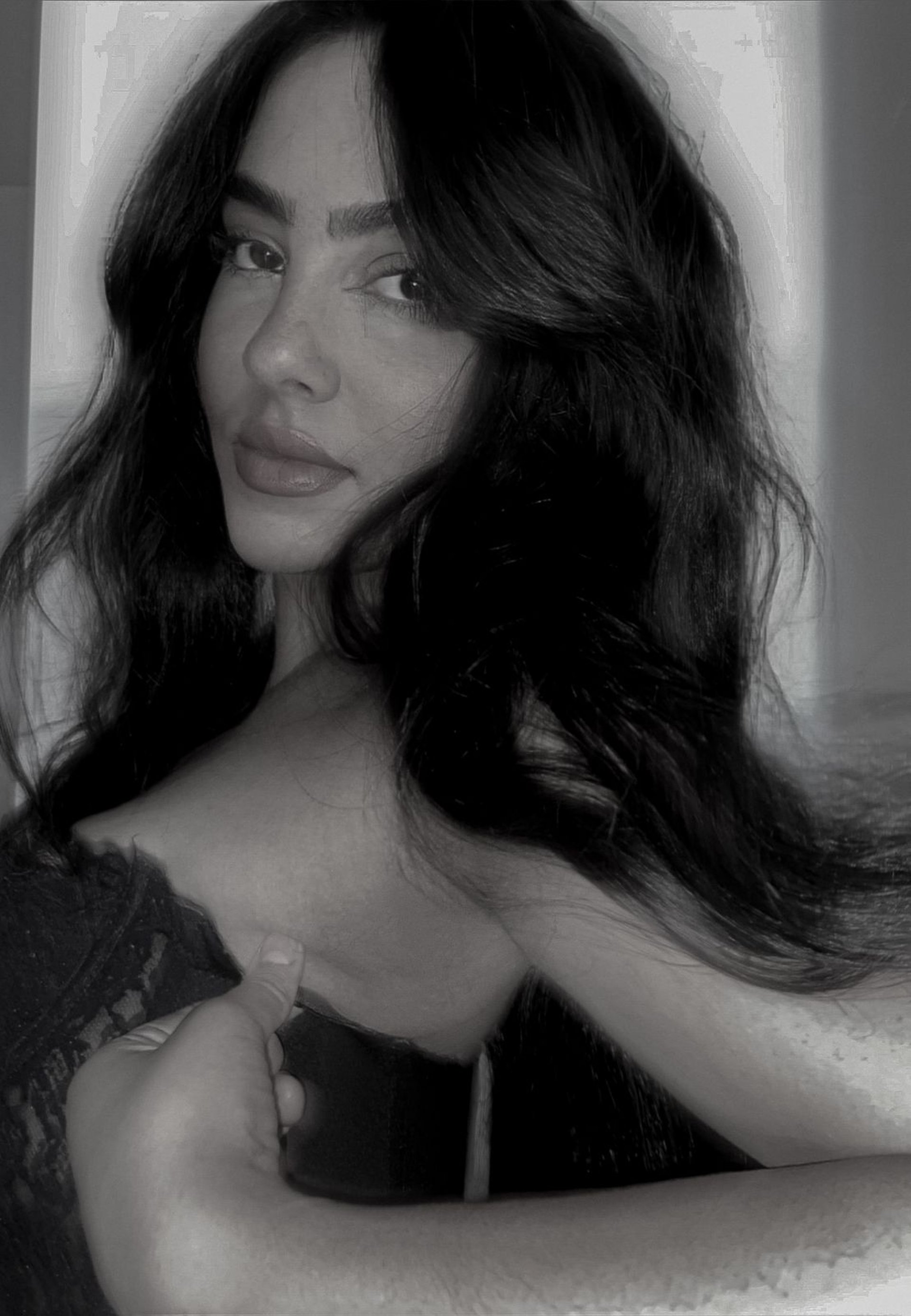 an abstract photo of a curved building with a blue sky in the background