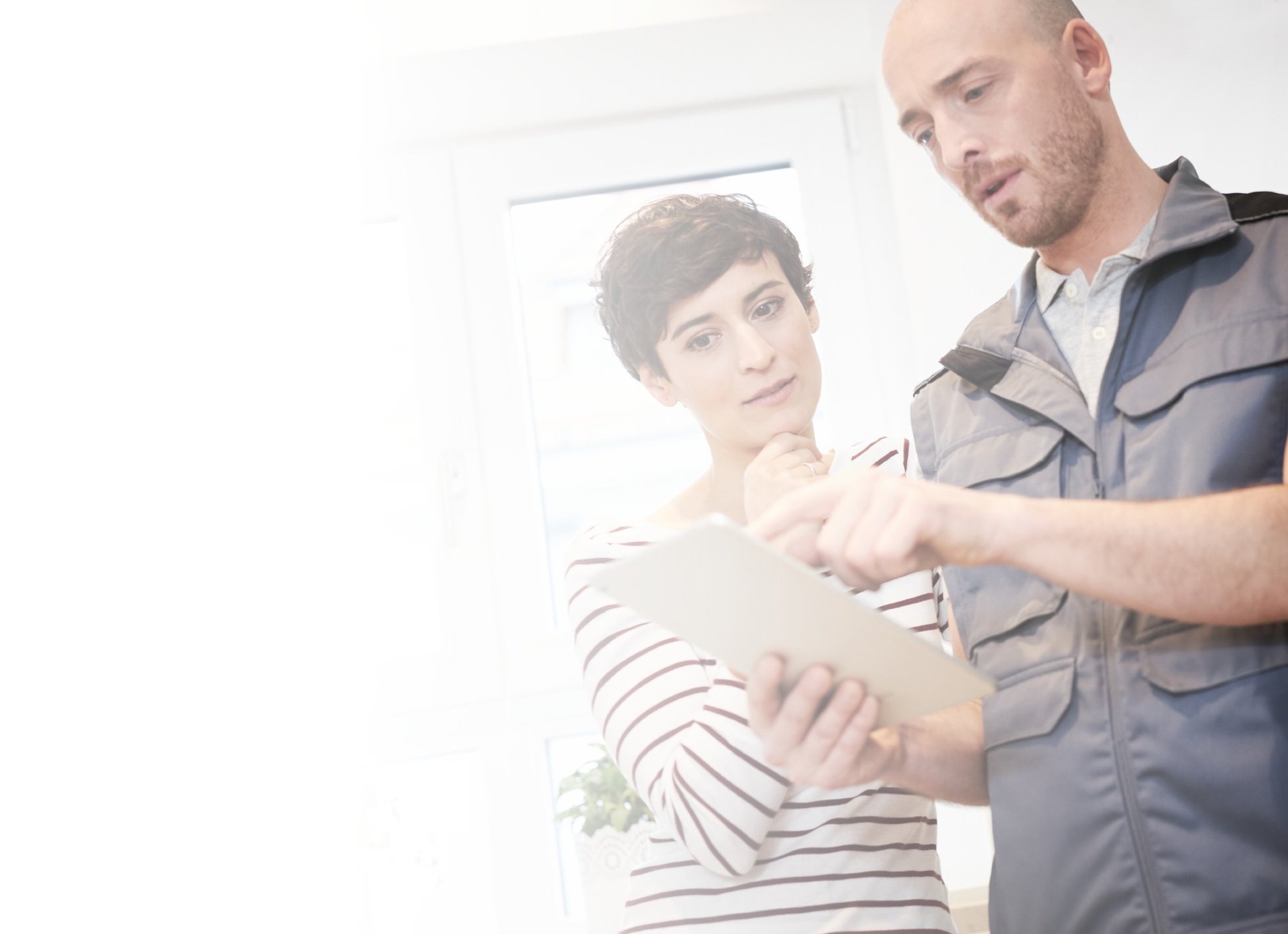 an abstract photo of a curved building with a blue sky in the background