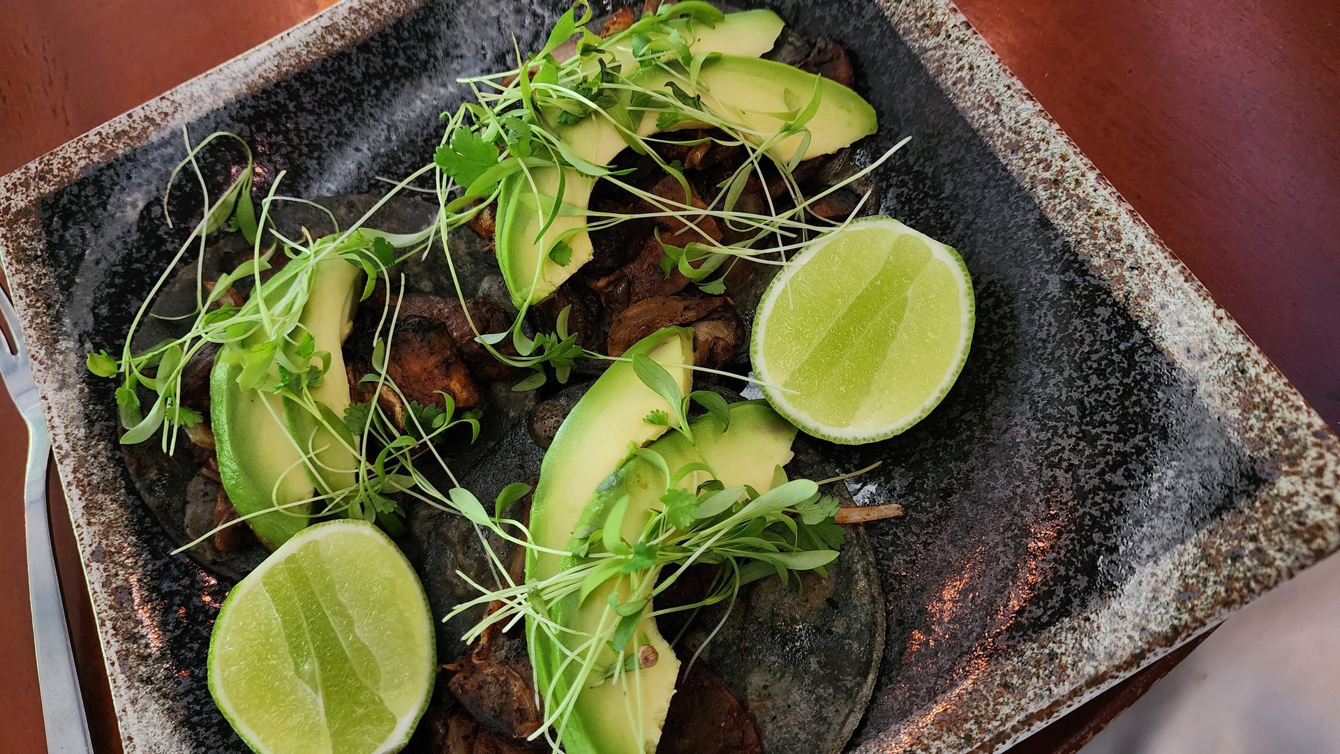 an abstract photo of a curved building with a blue sky in the background
