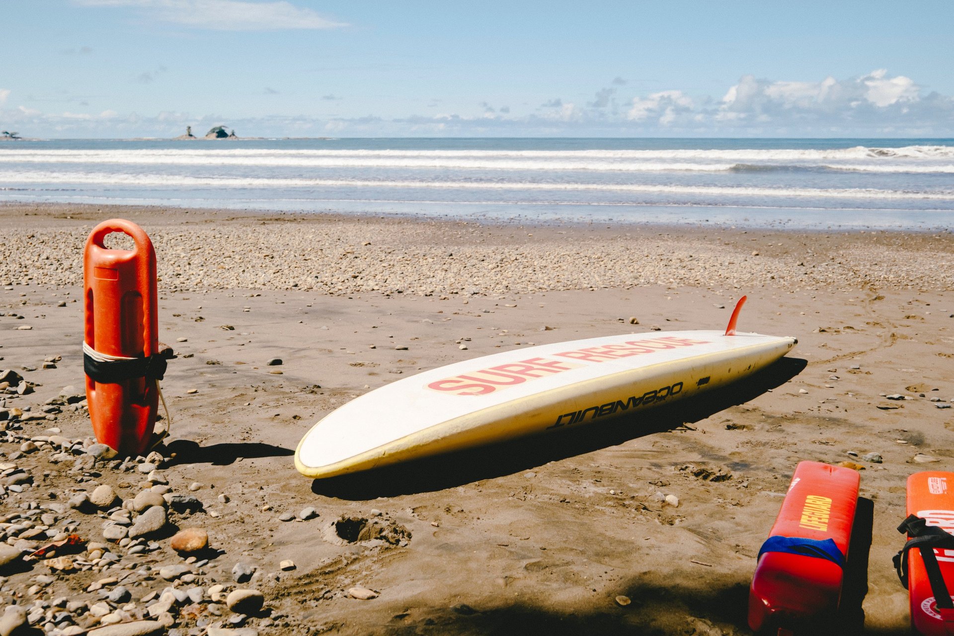 an abstract photo of a curved building with a blue sky in the background
