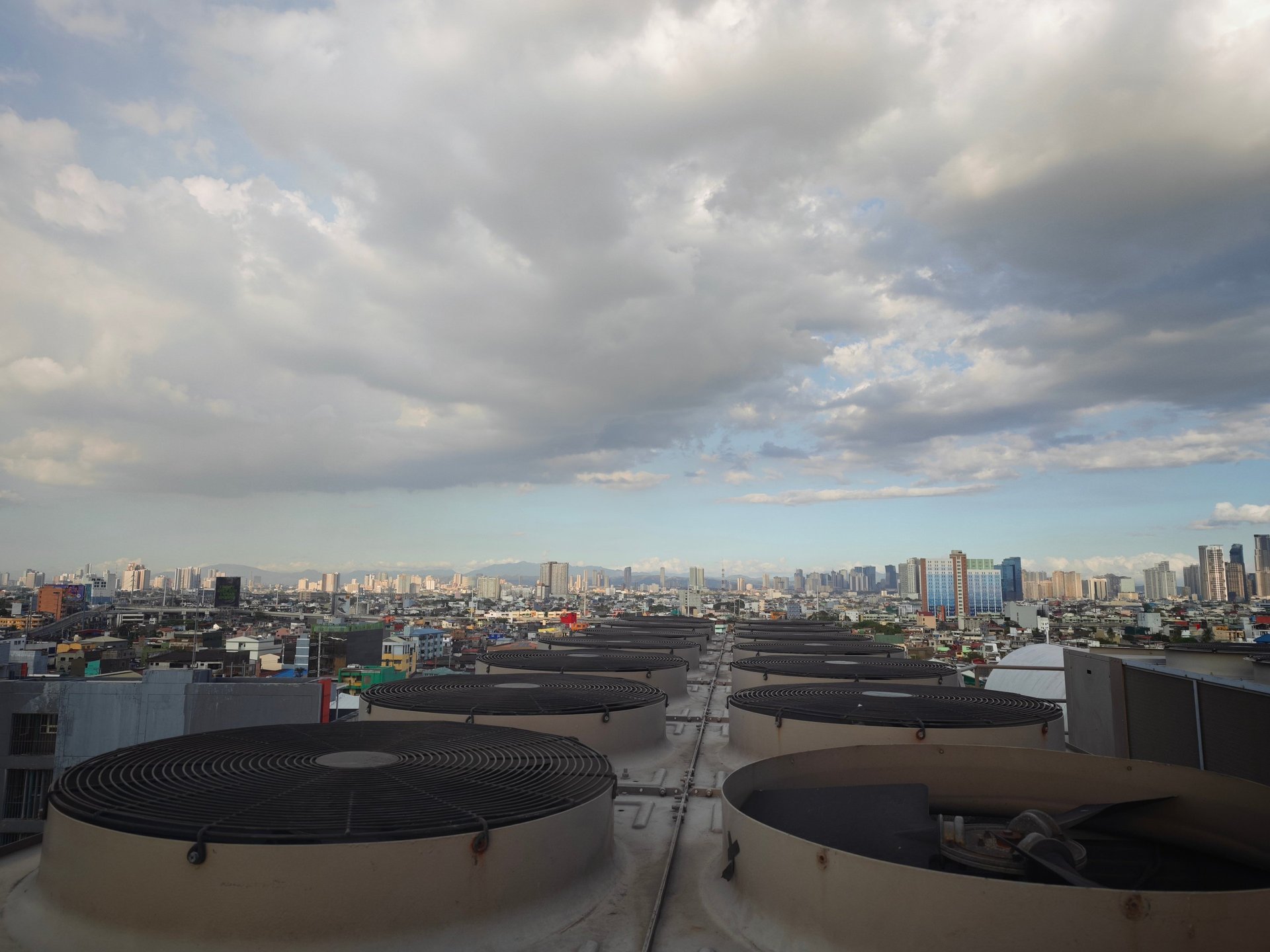 woman wearing yellow long-sleeved dress under white clouds and blue sky during daytime
