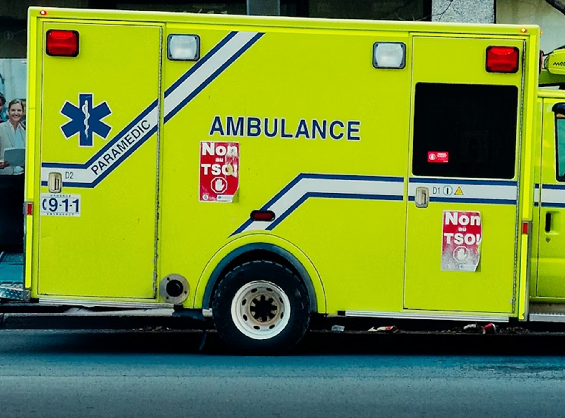 an ambulance is parked on the side of the street