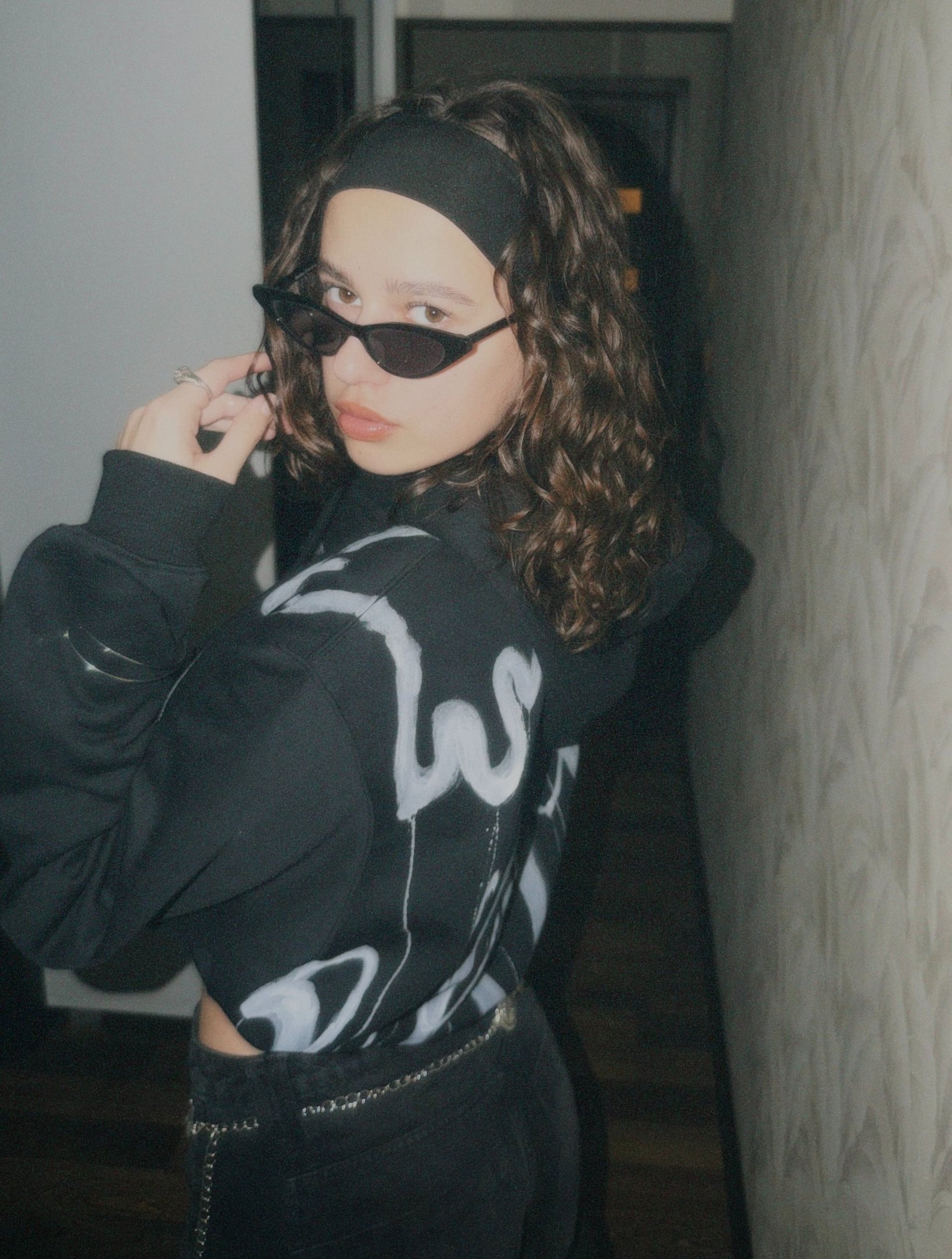 person wearing grey knit sweater