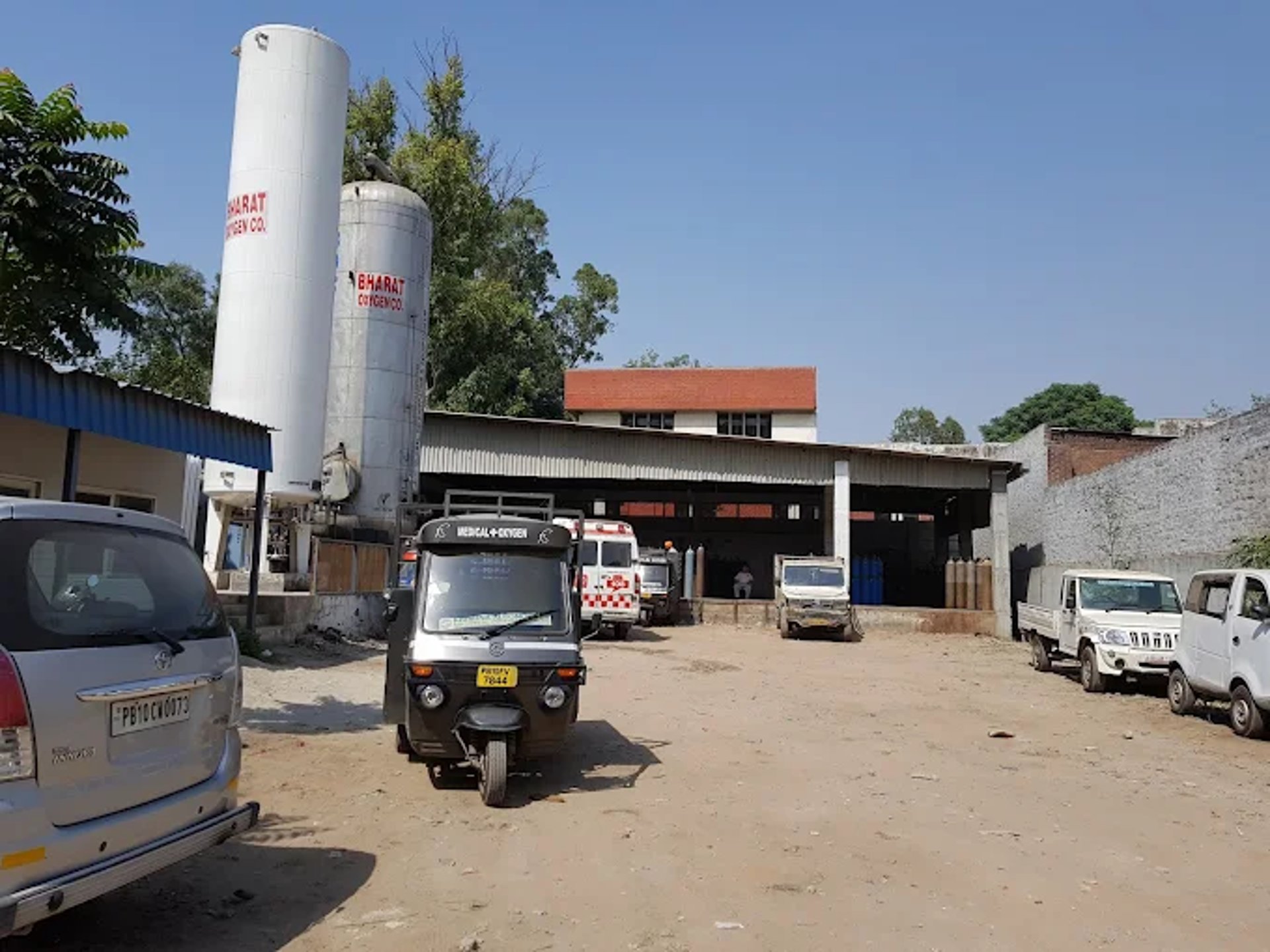 an abstract photo of a curved building with a blue sky in the background