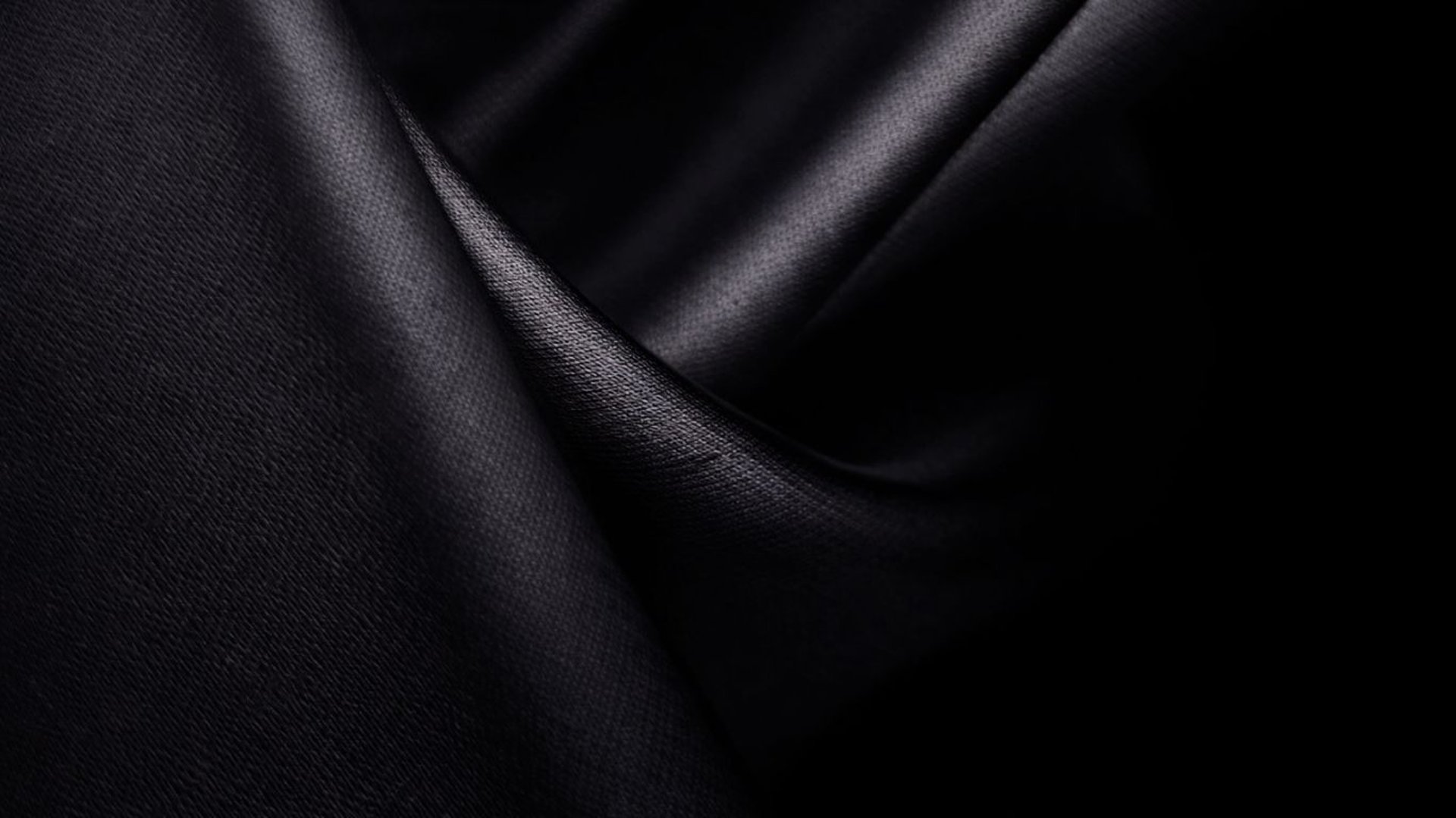 an abstract black background with curved lines