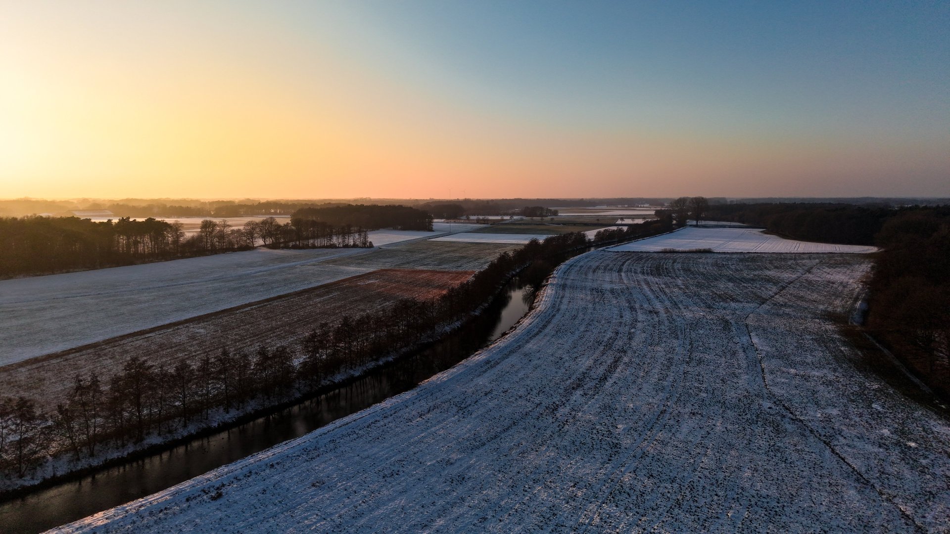 a building in a field with a mountain in the background