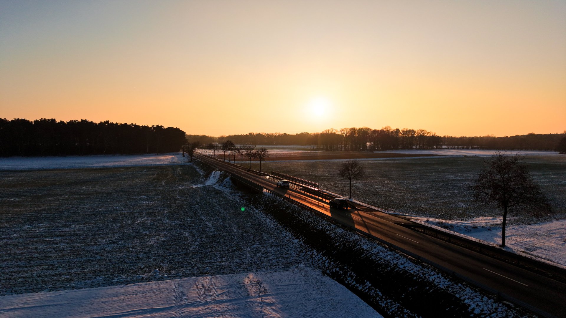 a building in a field with a mountain in the background