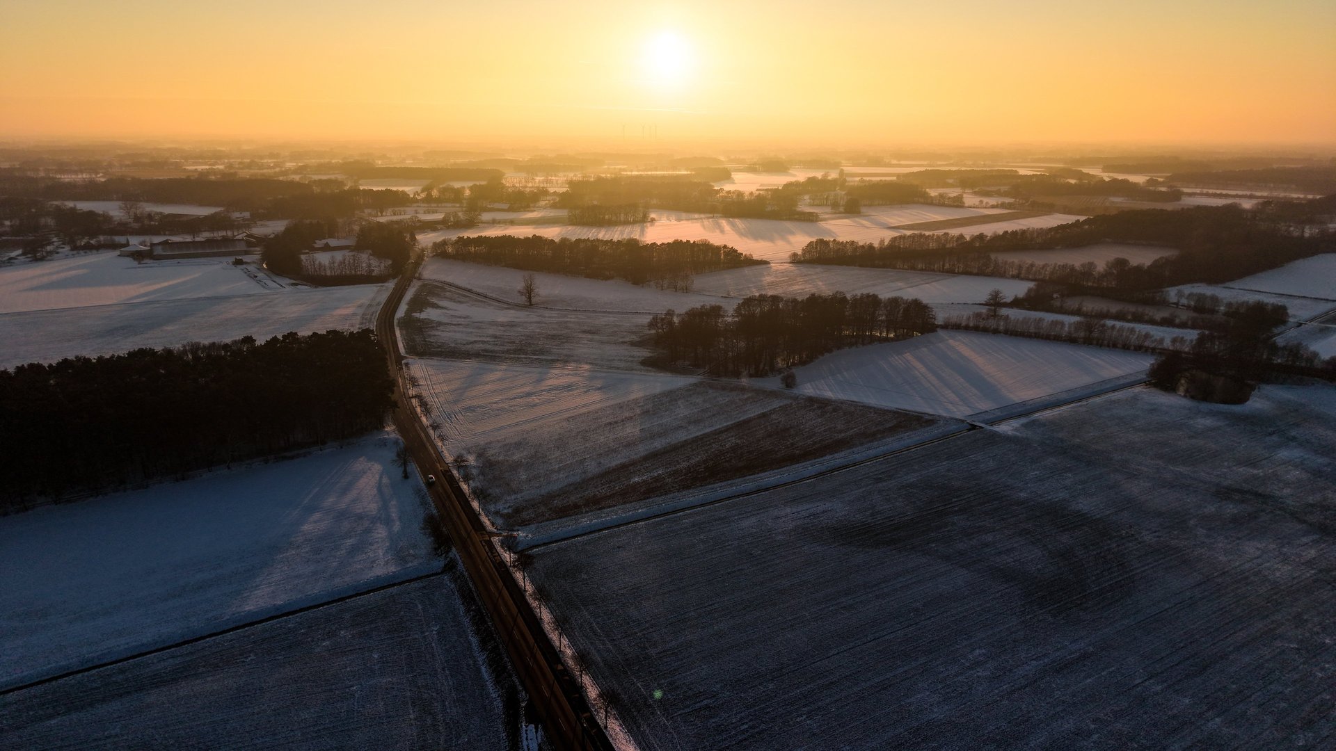 a building in a field with a mountain in the background