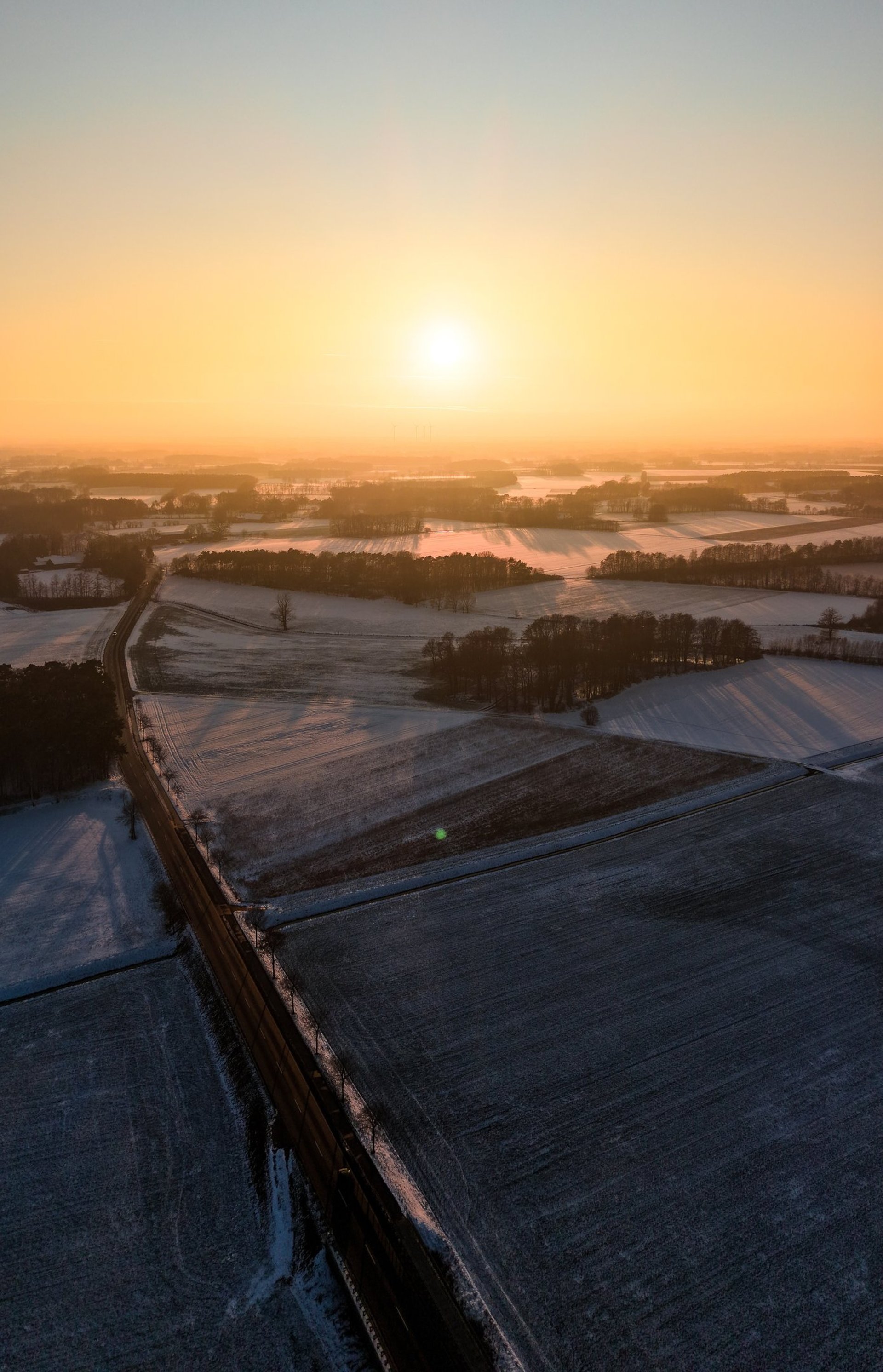 a building in a field with a mountain in the background