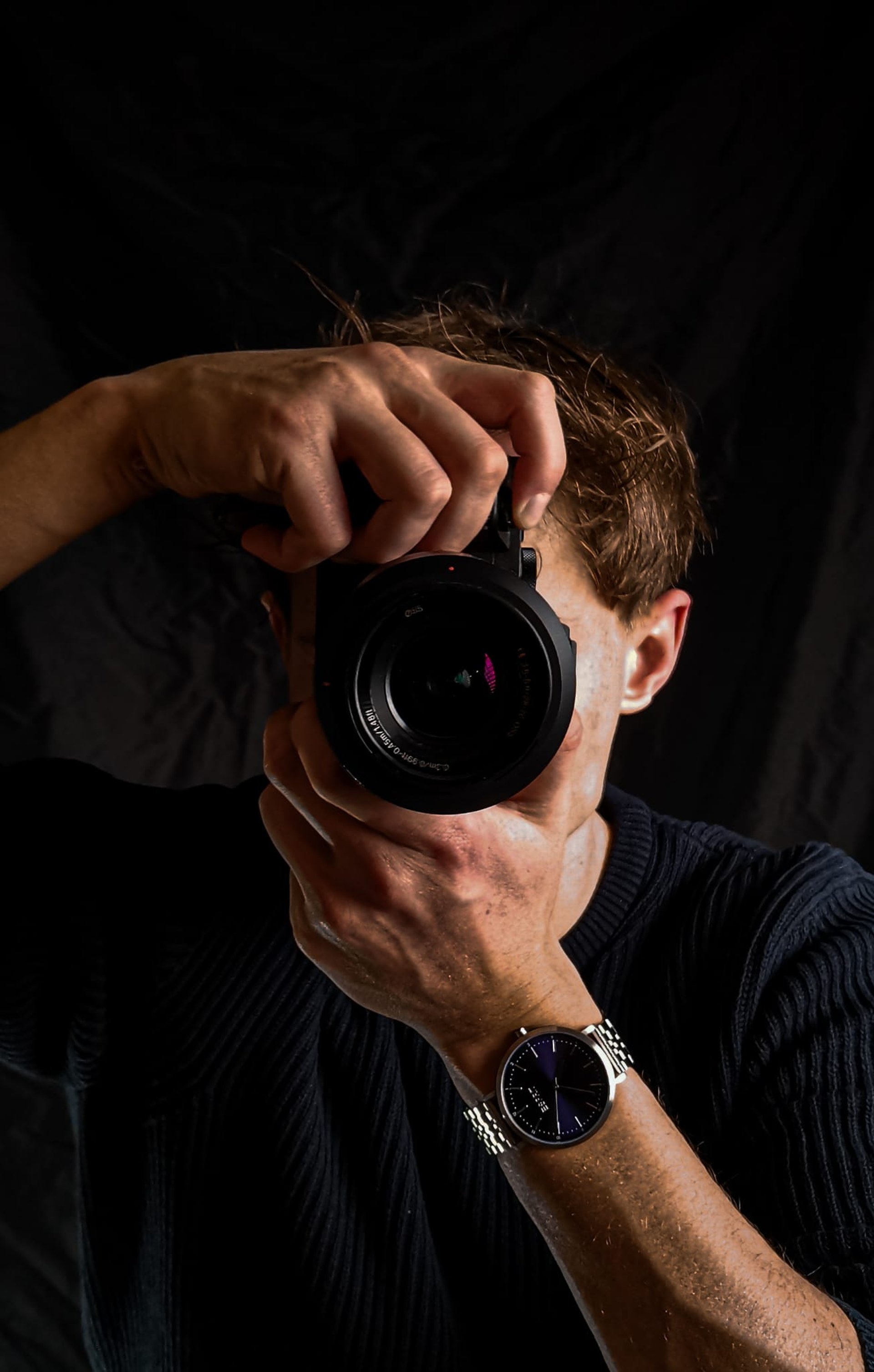 person holding DSLR camera