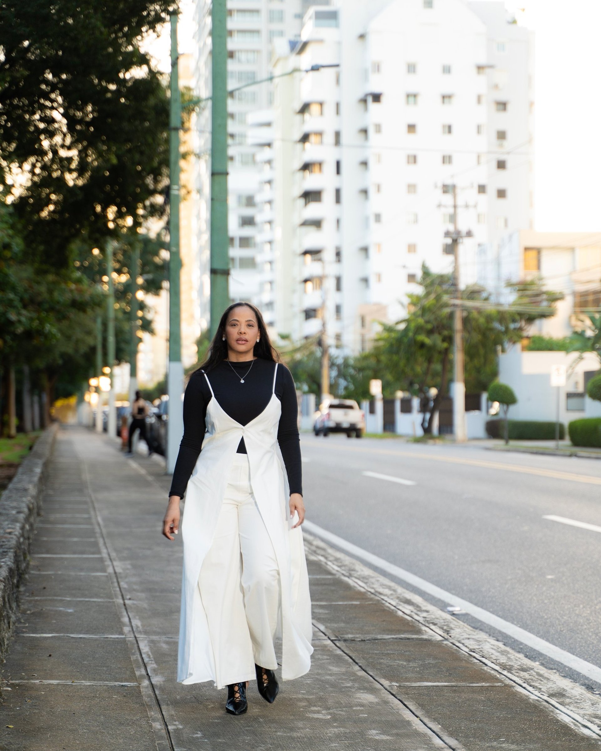 an abstract photo of a curved building with a blue sky in the background