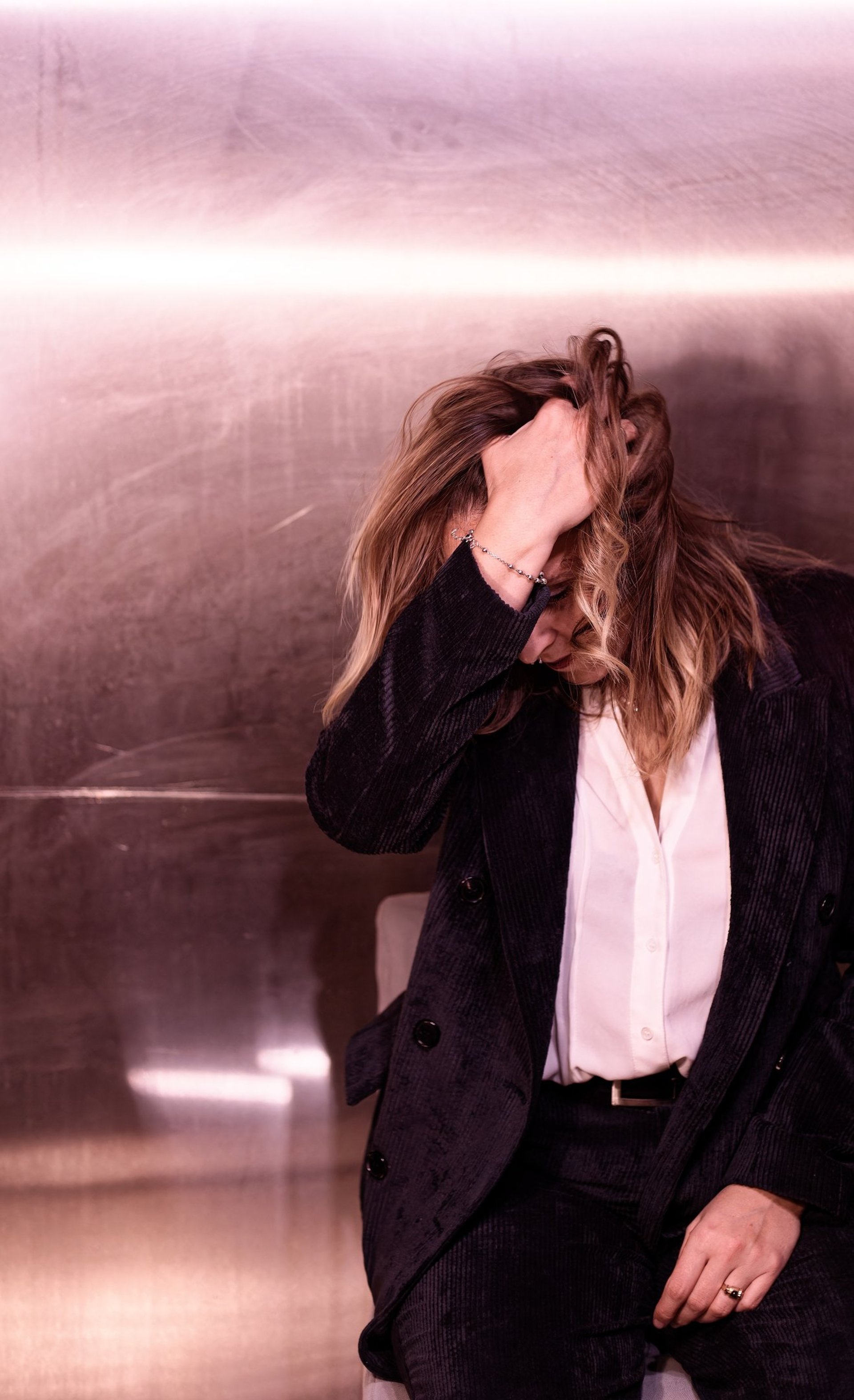 an abstract photo of a curved building with a blue sky in the background