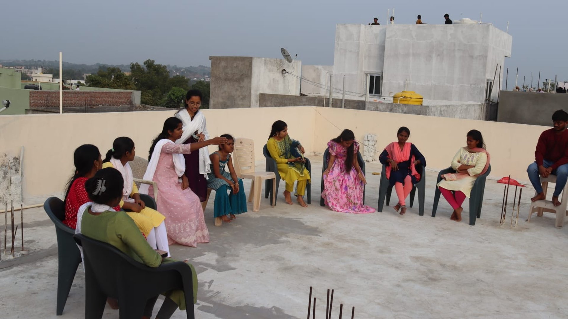 woman wearing yellow long-sleeved dress under white clouds and blue sky during daytime