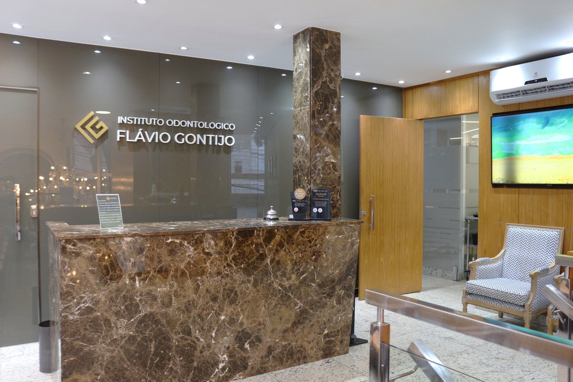 an abstract photo of a curved building with a blue sky in the background