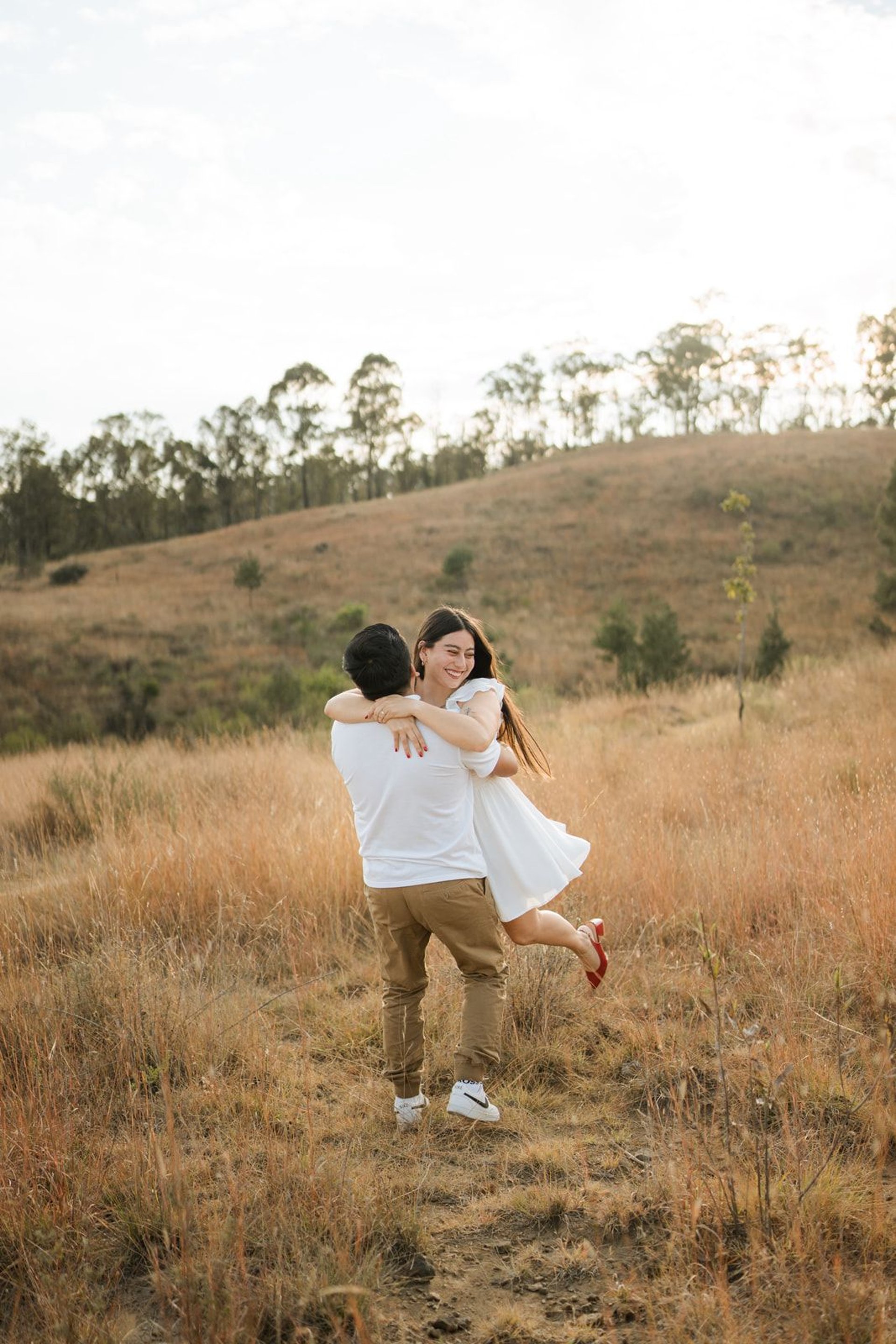 couple wearing silver-colored rings