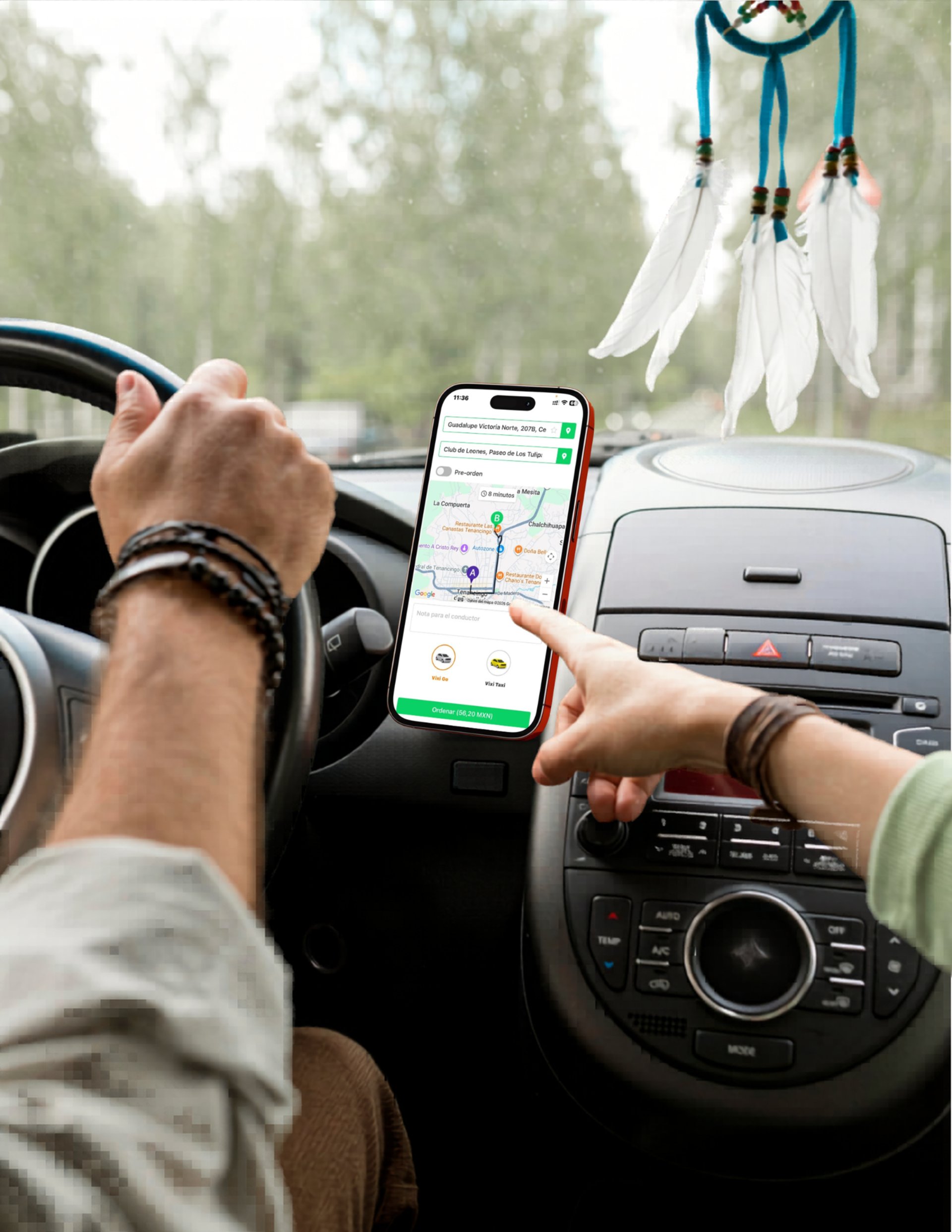 person holding iphone 6 inside car
