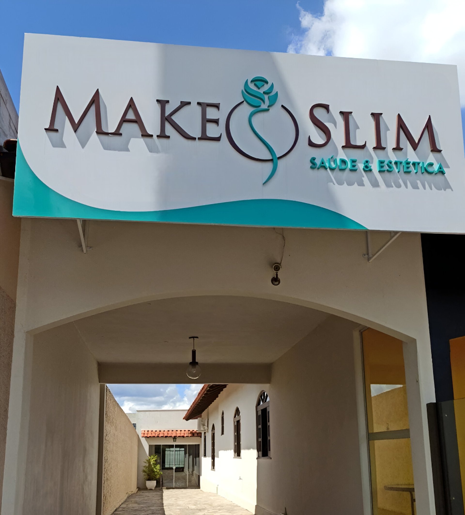 an abstract photo of a curved building with a blue sky in the background