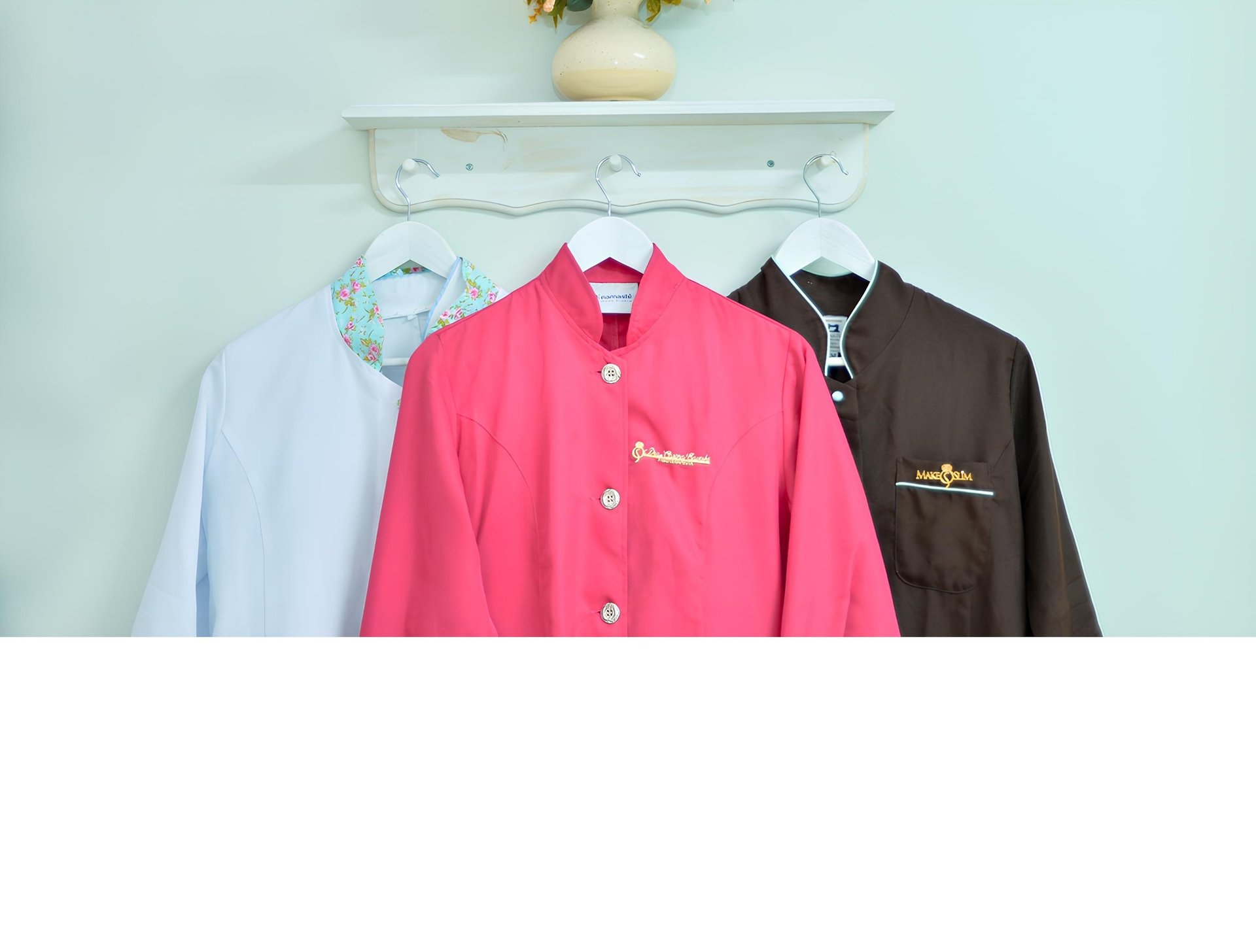 woman in white long sleeve shirt covering face with hand