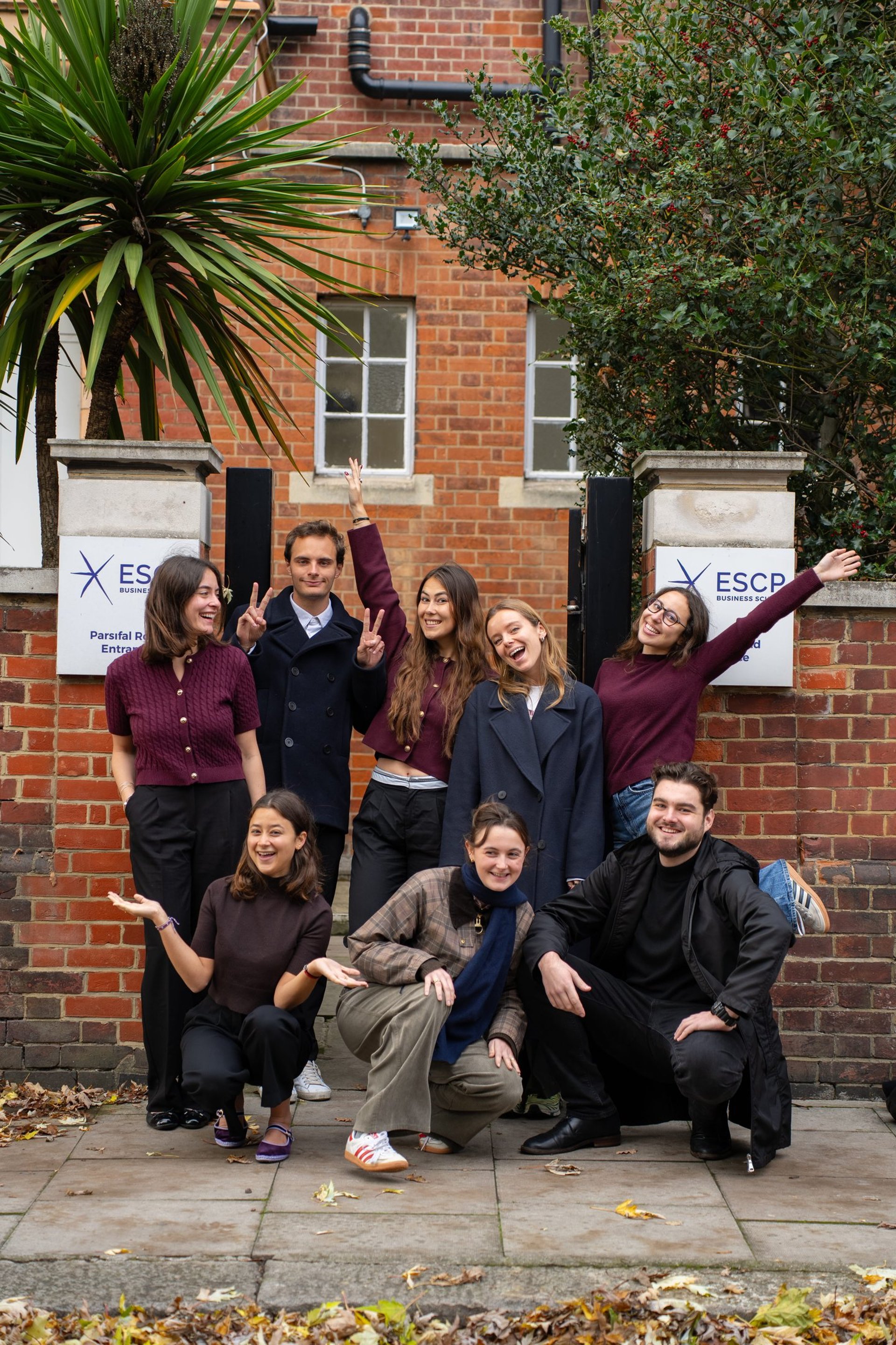 group of people sitting on bench near trees duting daytime