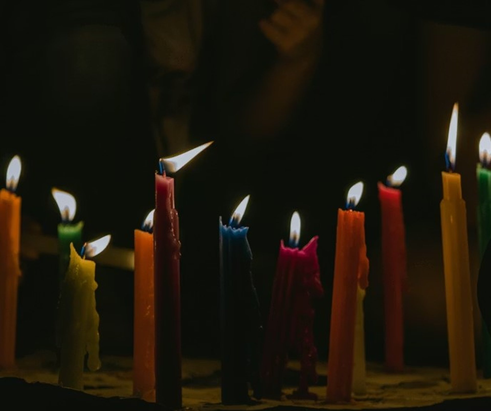 an abstract photo of a curved building with a blue sky in the background
