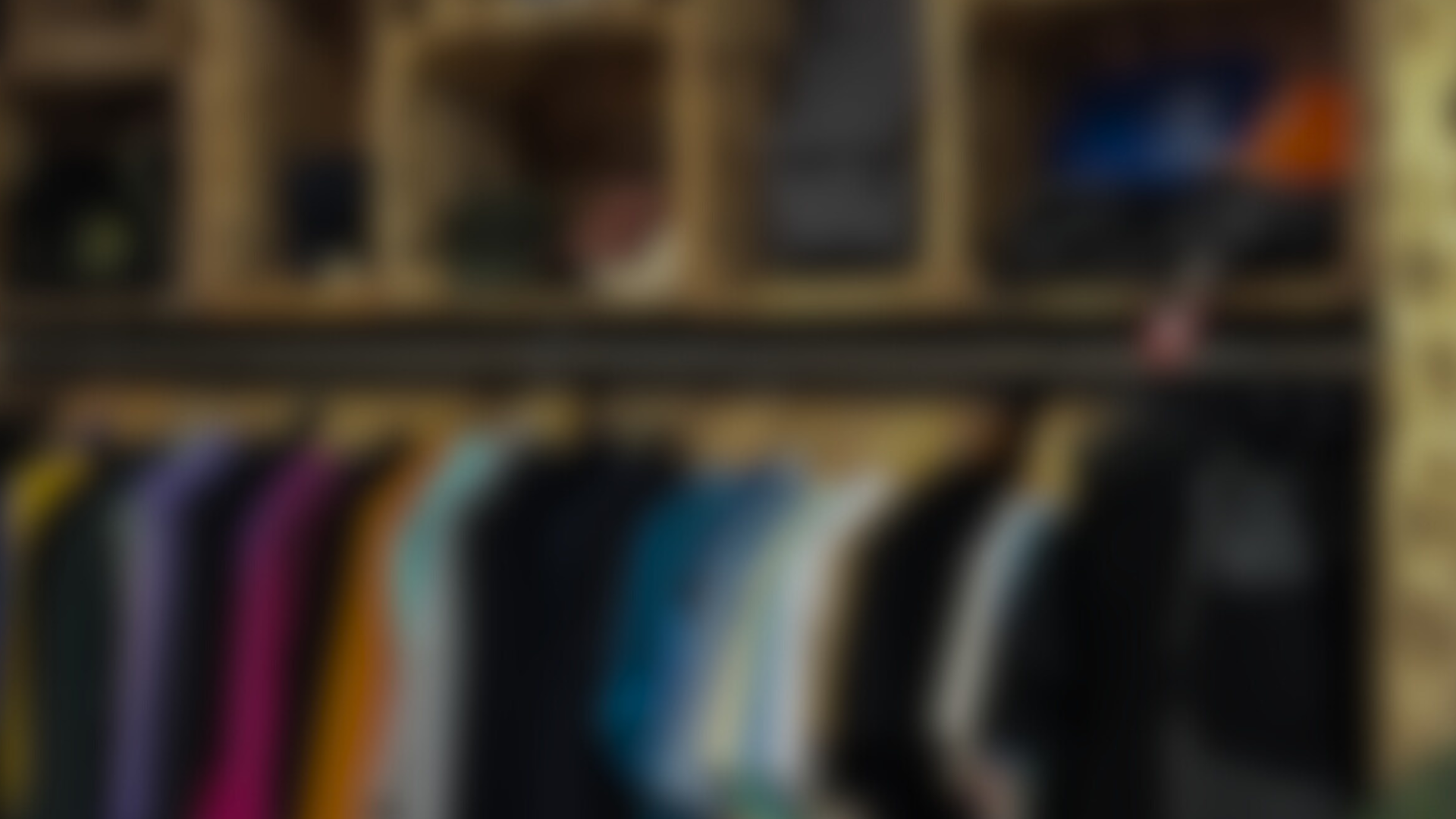 an abstract photo of a curved building with a blue sky in the background