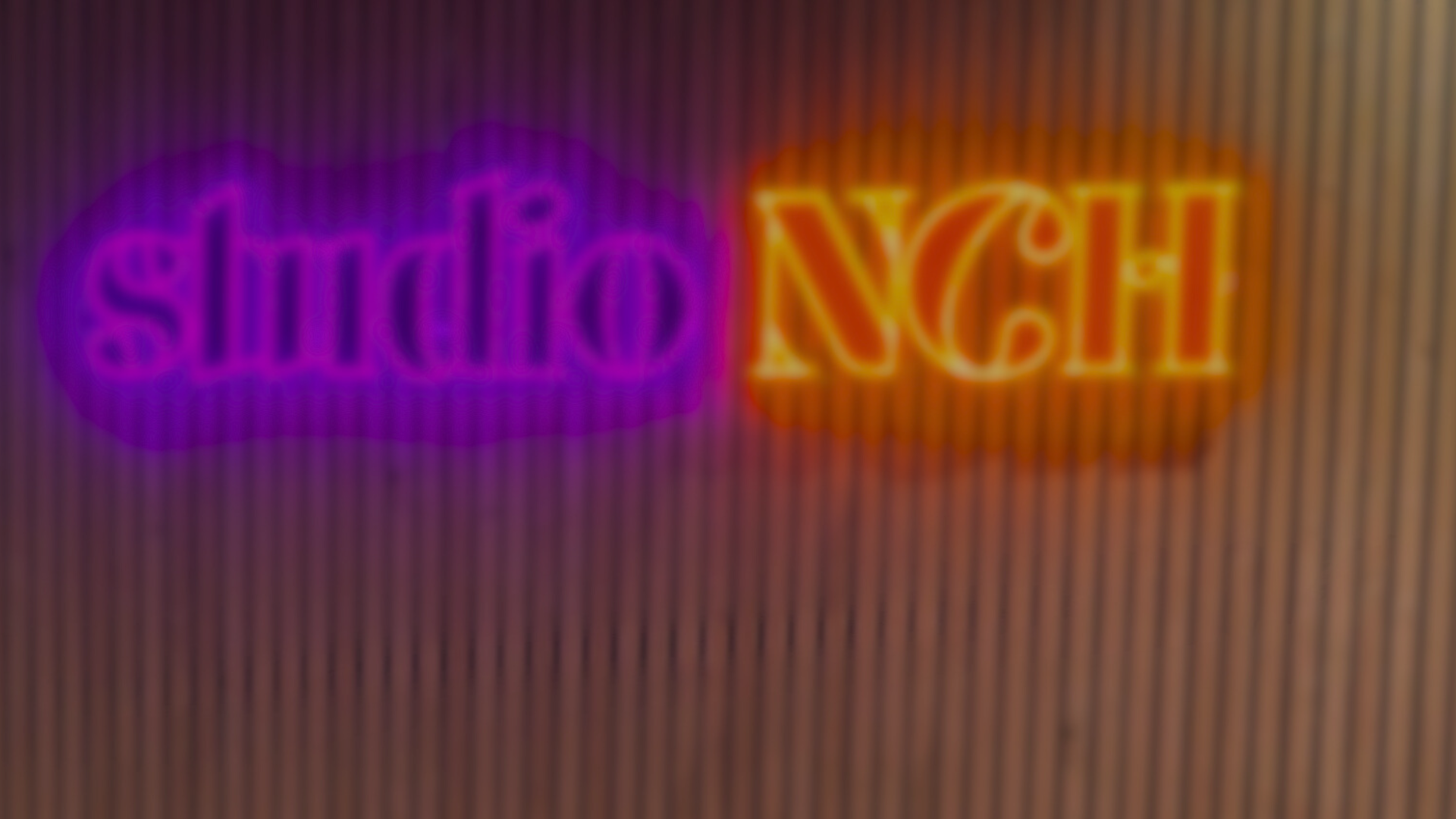 an abstract photo of a curved building with a blue sky in the background