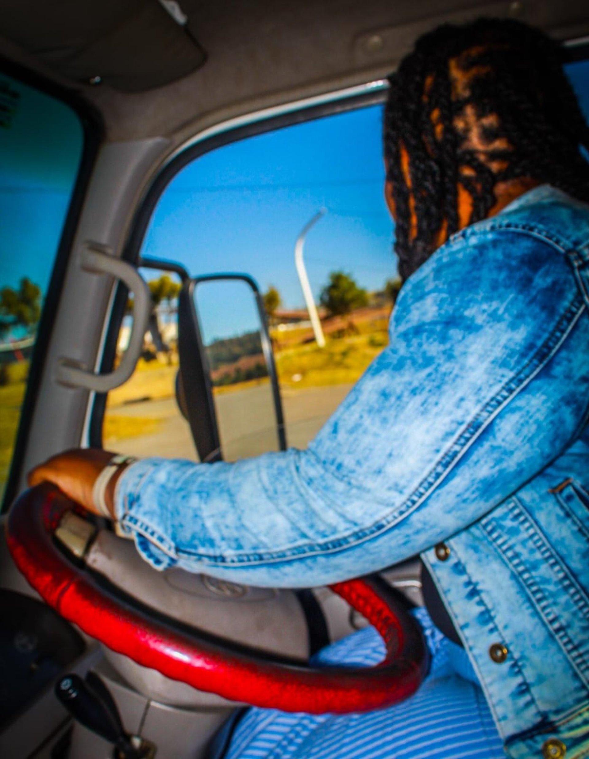 woman wearing yellow long-sleeved dress under white clouds and blue sky during daytime