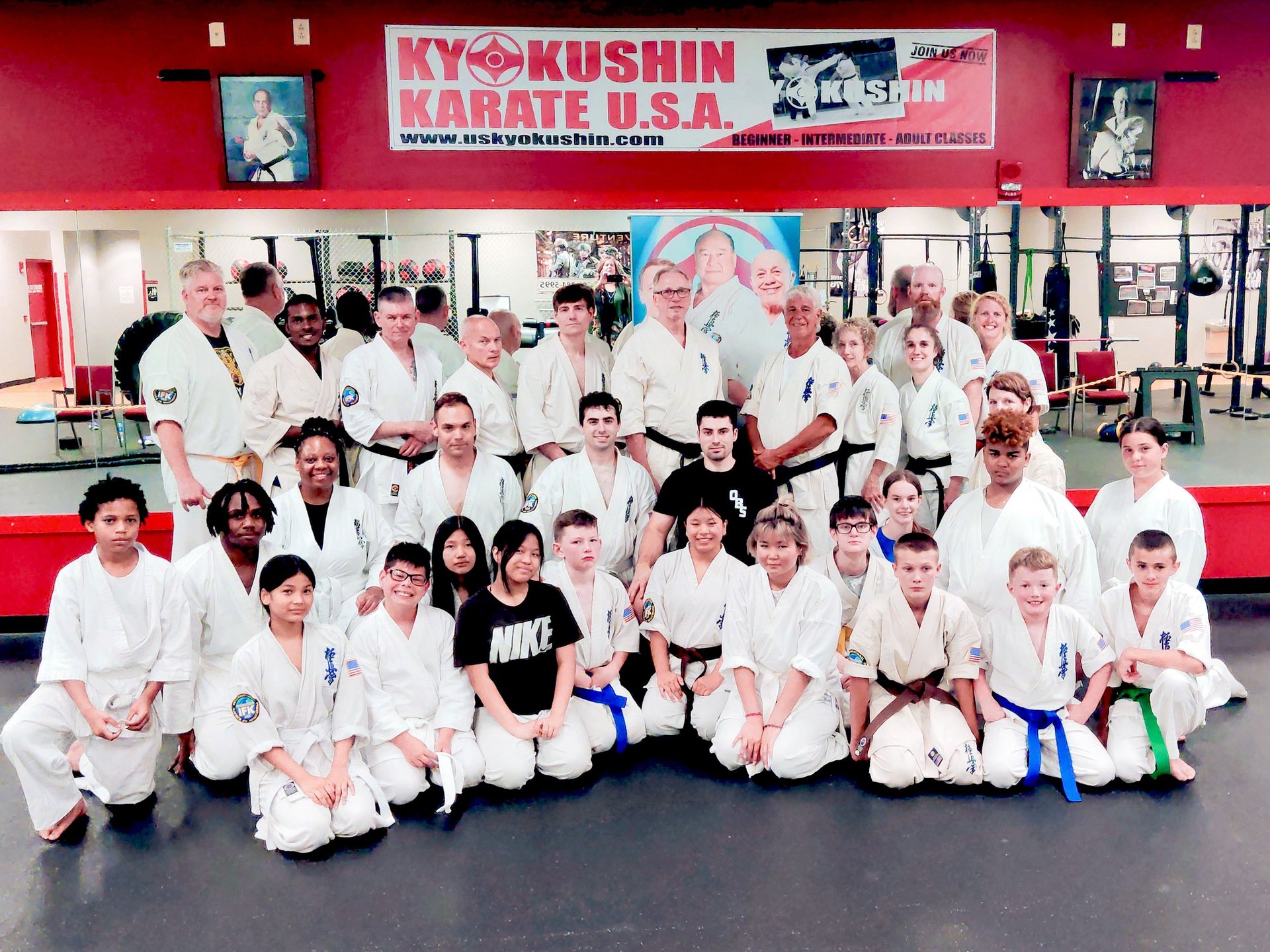 Group photo of students with Shihan Mike Monaco and Shihan David Pickthall at Kyokushin Karate USA in Rochester NY