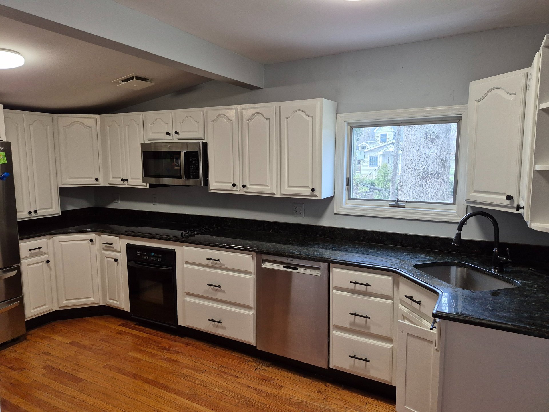 black and brown leather padded tub sofa