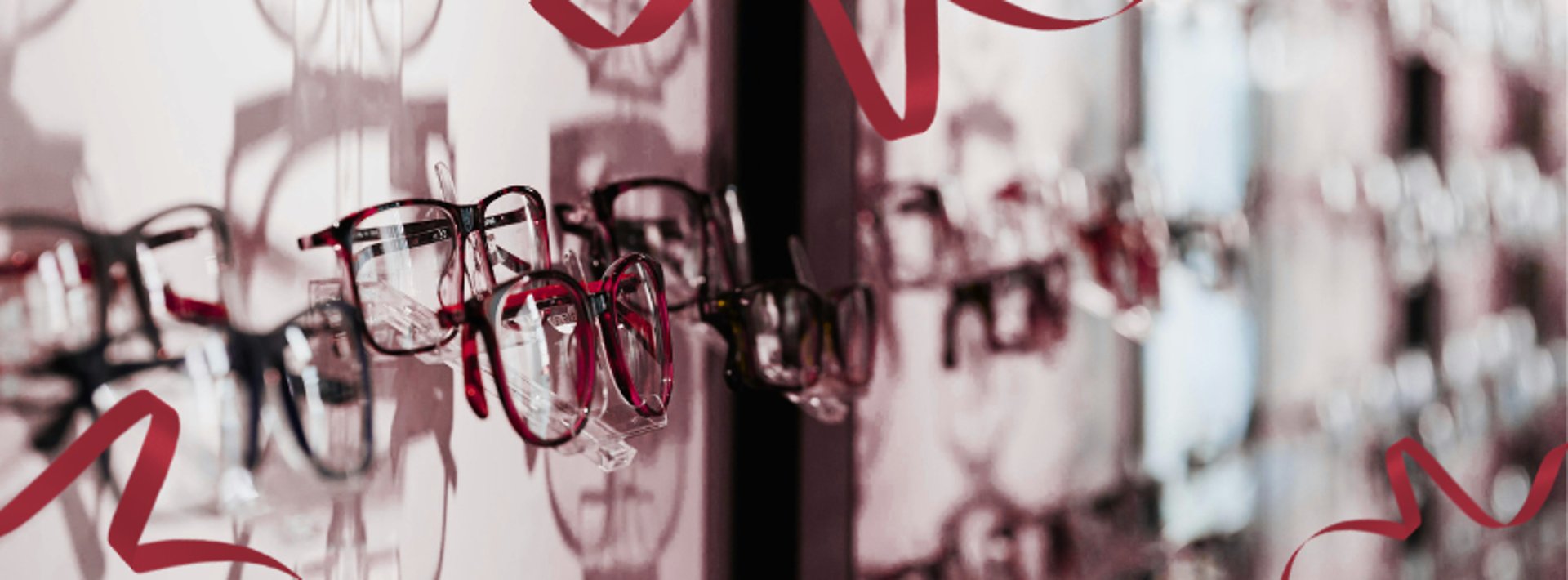 silver framed eyeglasses on clear glass