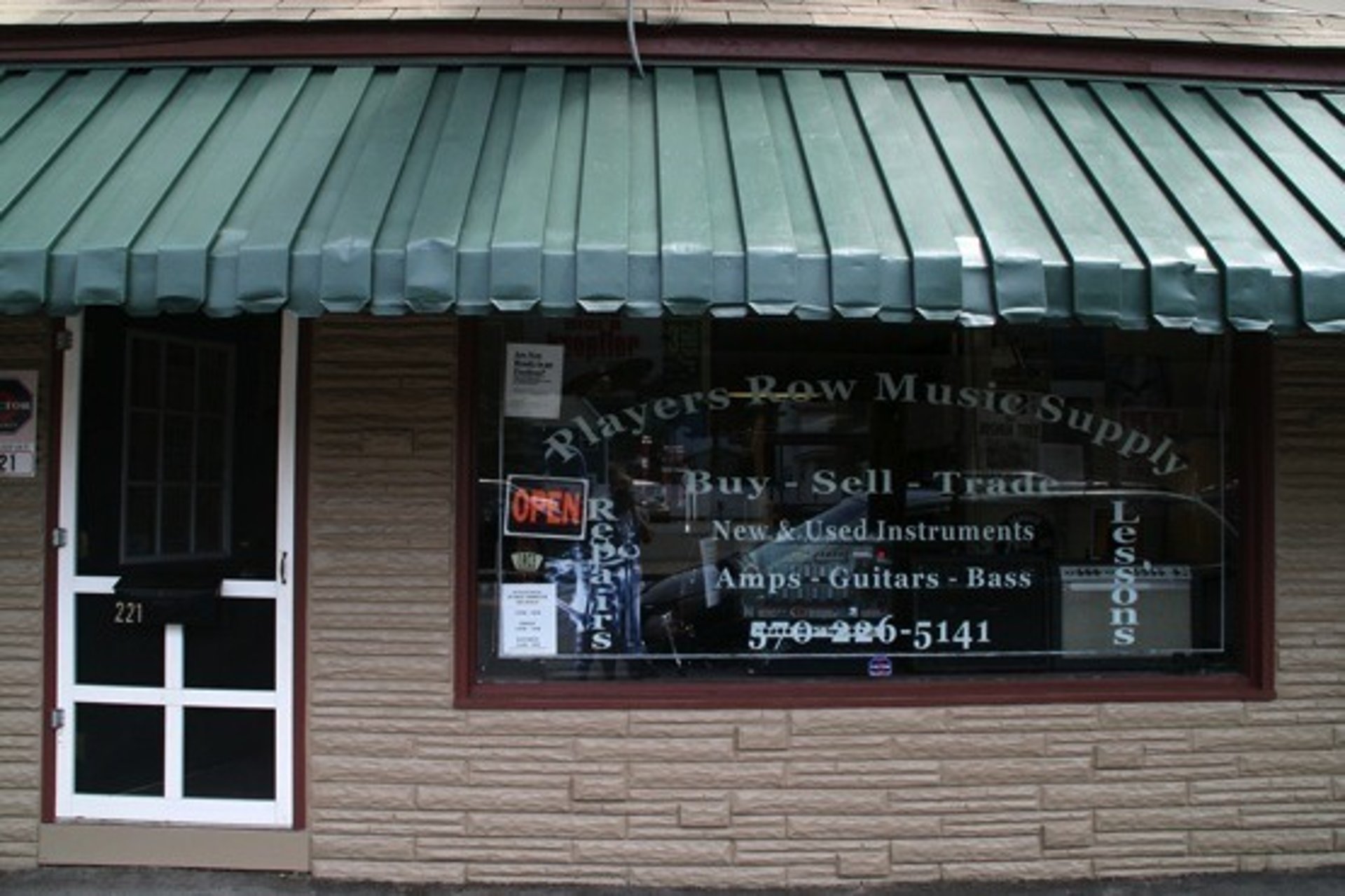 an abstract photo of a curved building with a blue sky in the background
