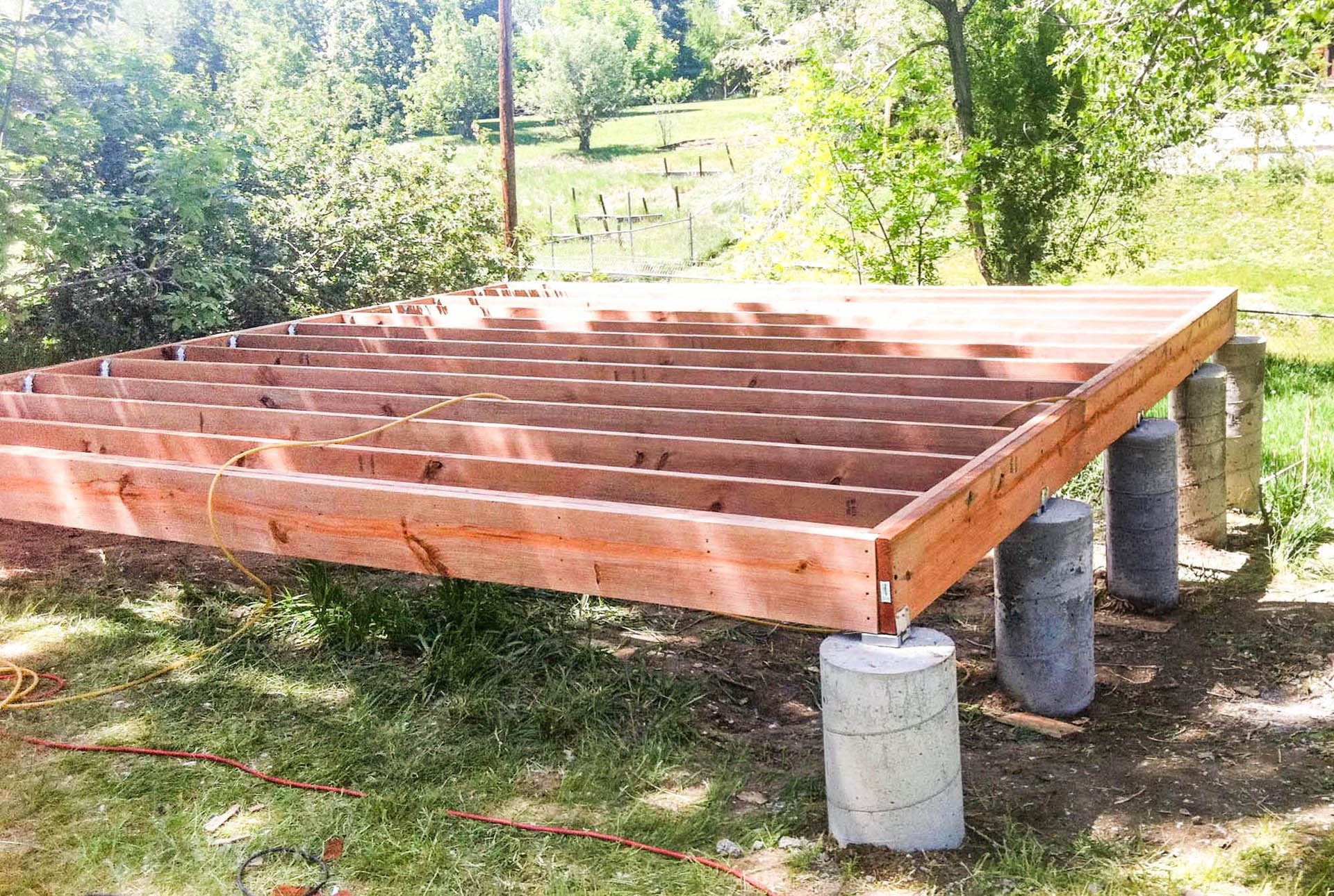 Custom shed floor joists and foundation piers built by Brewer Construction in Denver, Colorado.